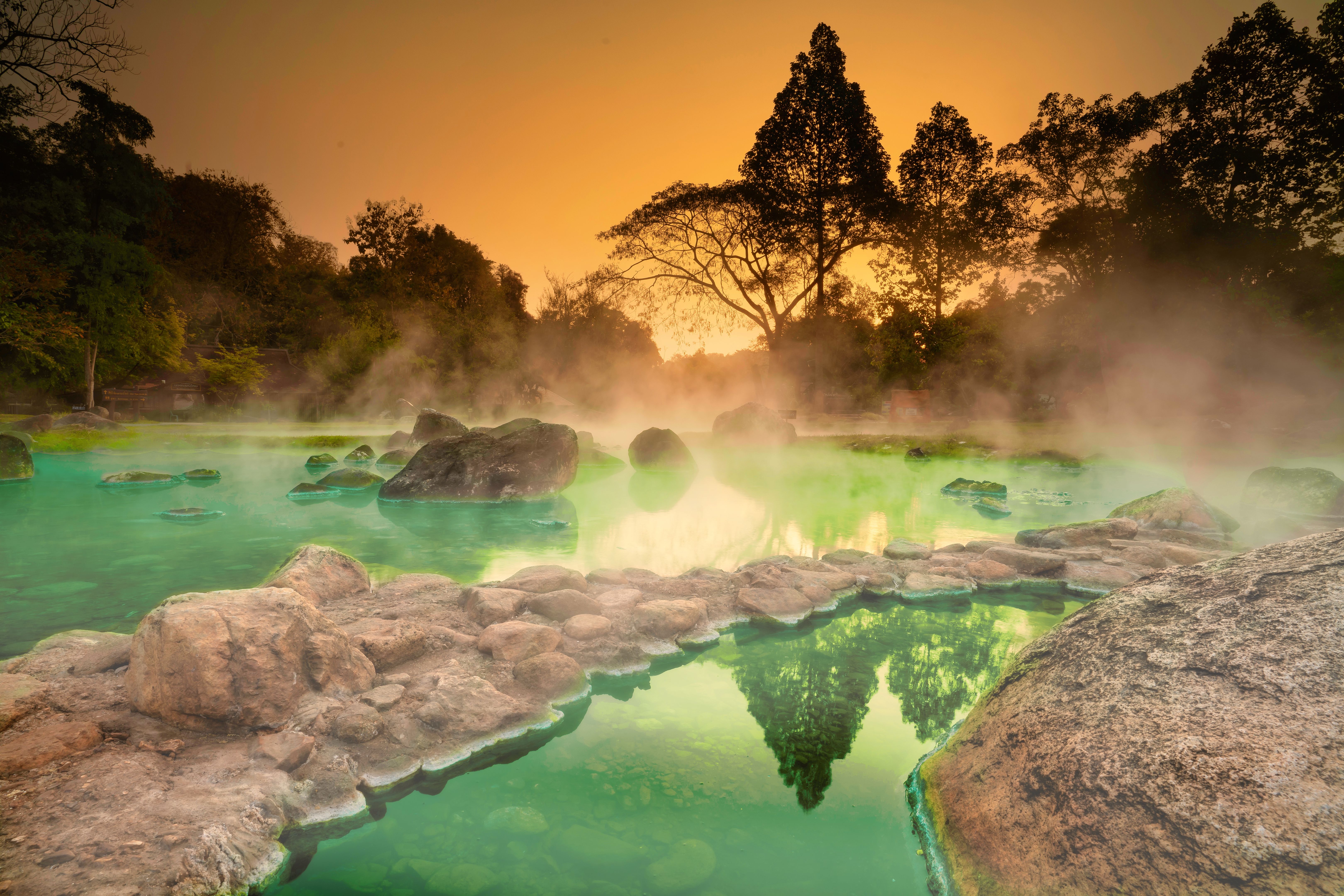 Hot Springs Onsen Natural Bath at National Park Chae Son, Lampang Thailand.In the morning sunrise.Natural hot spring bath surrounded by mountains in northern Thailand.