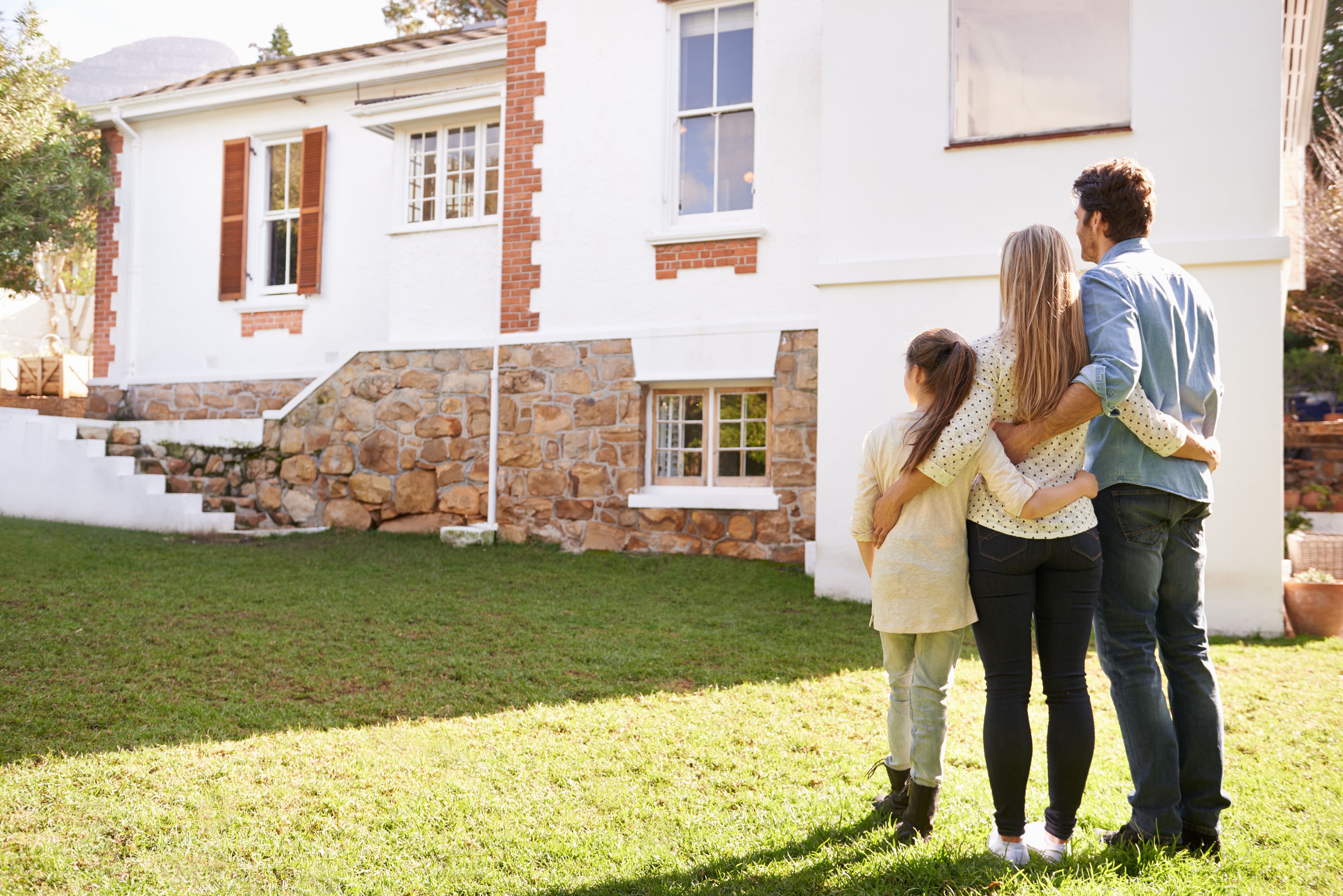 family looking at house