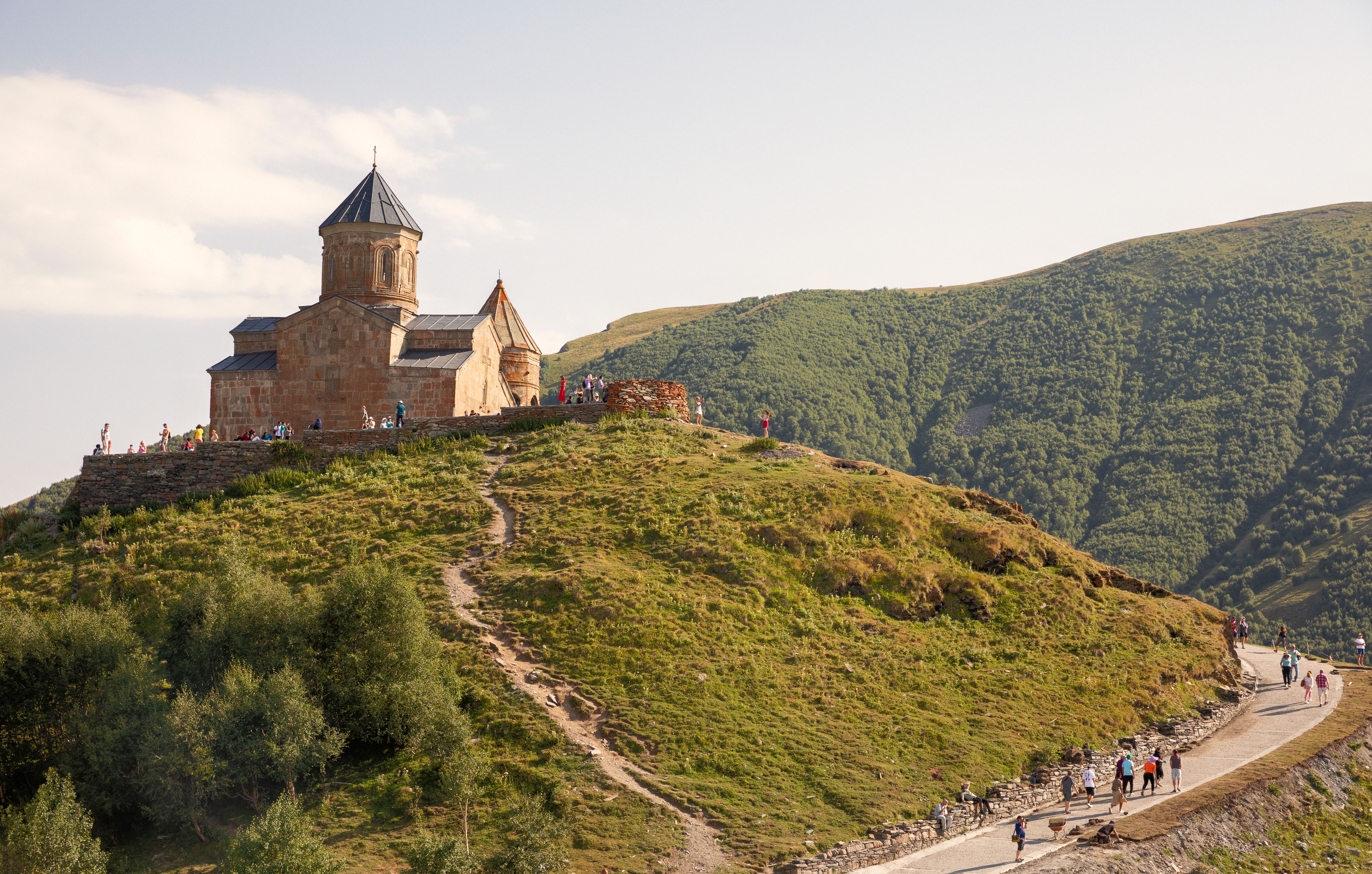 Gergeti Trinity Church with view of  Caucasus mountains