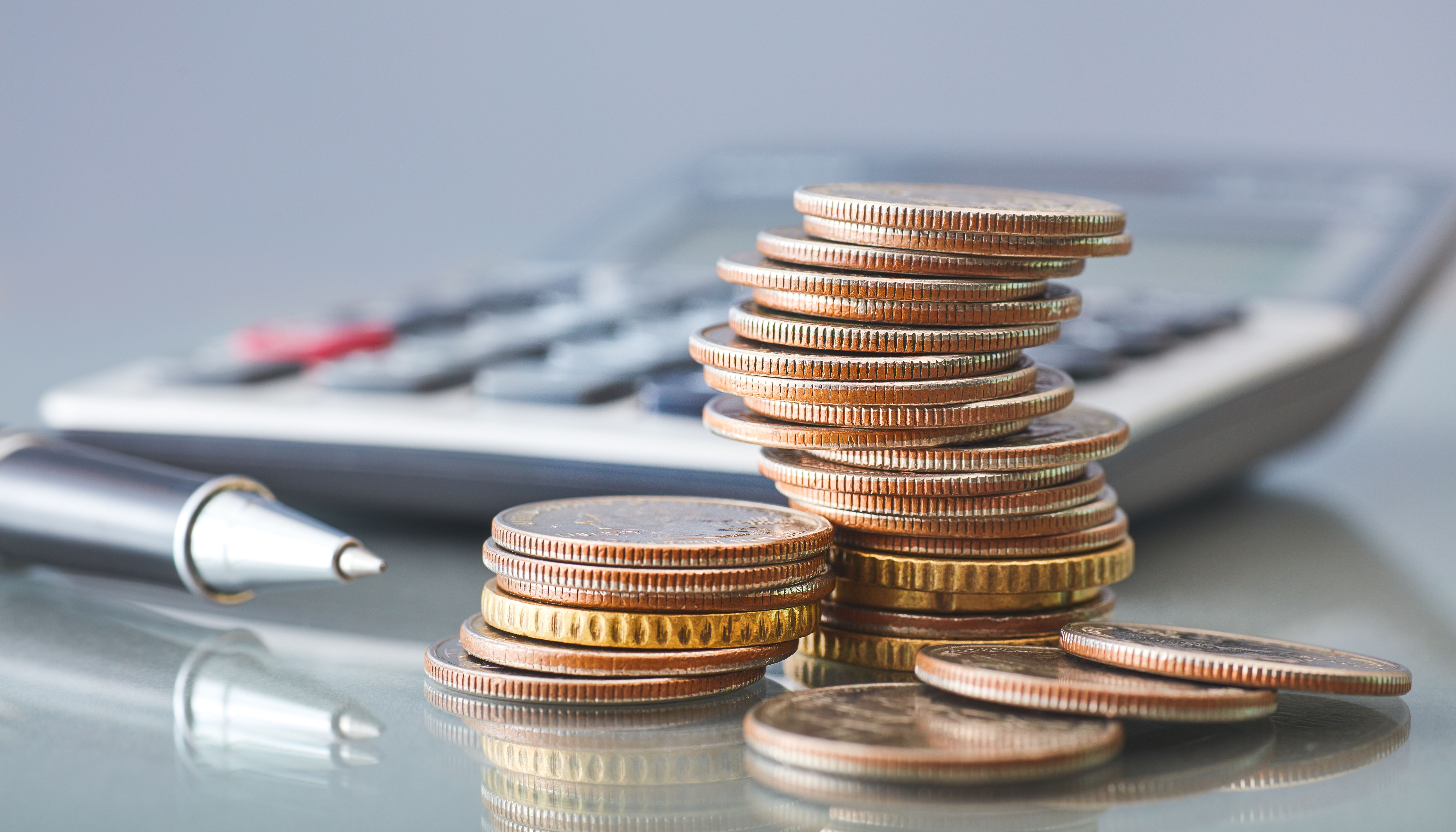 calculator and coins