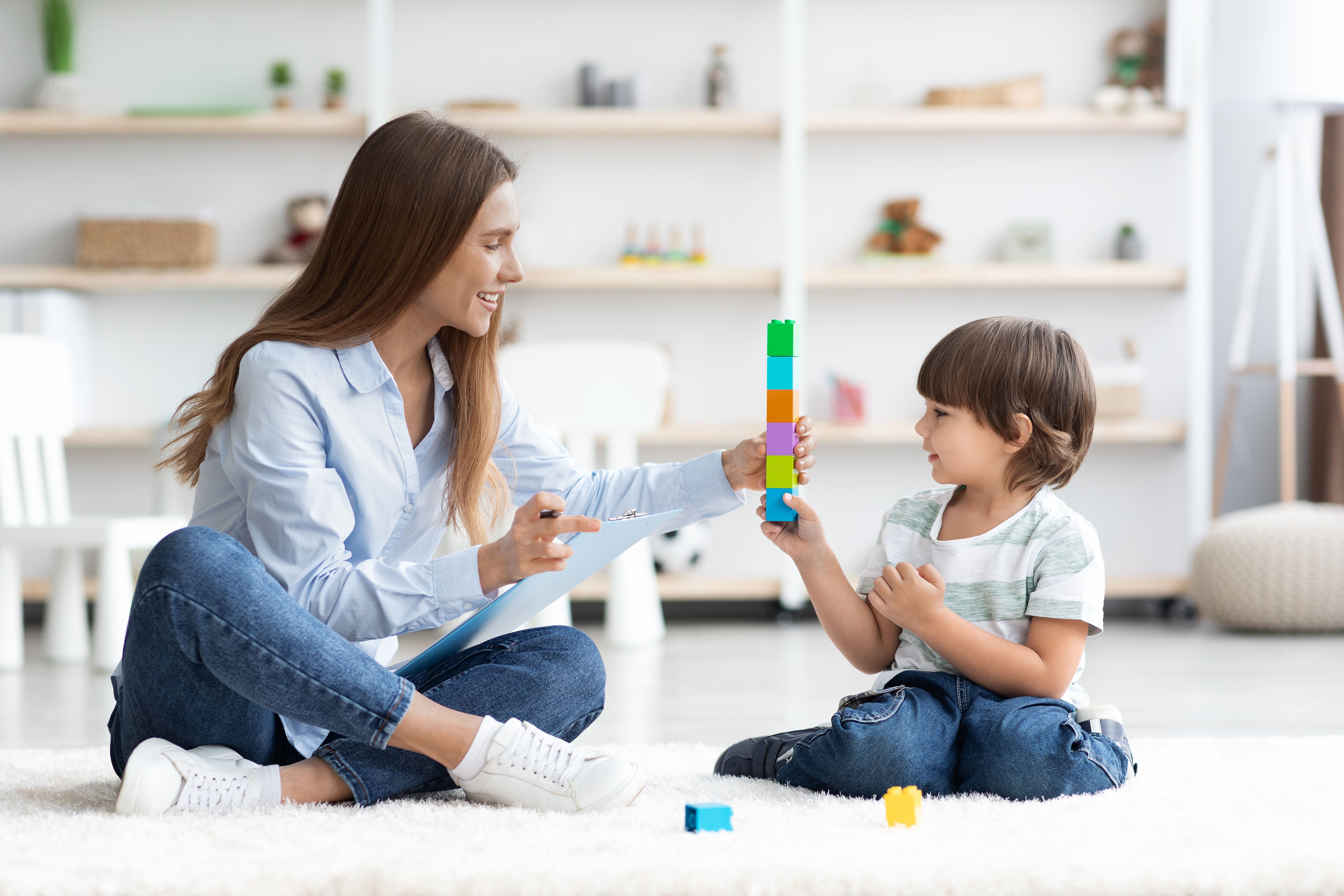 child playing with babysitter