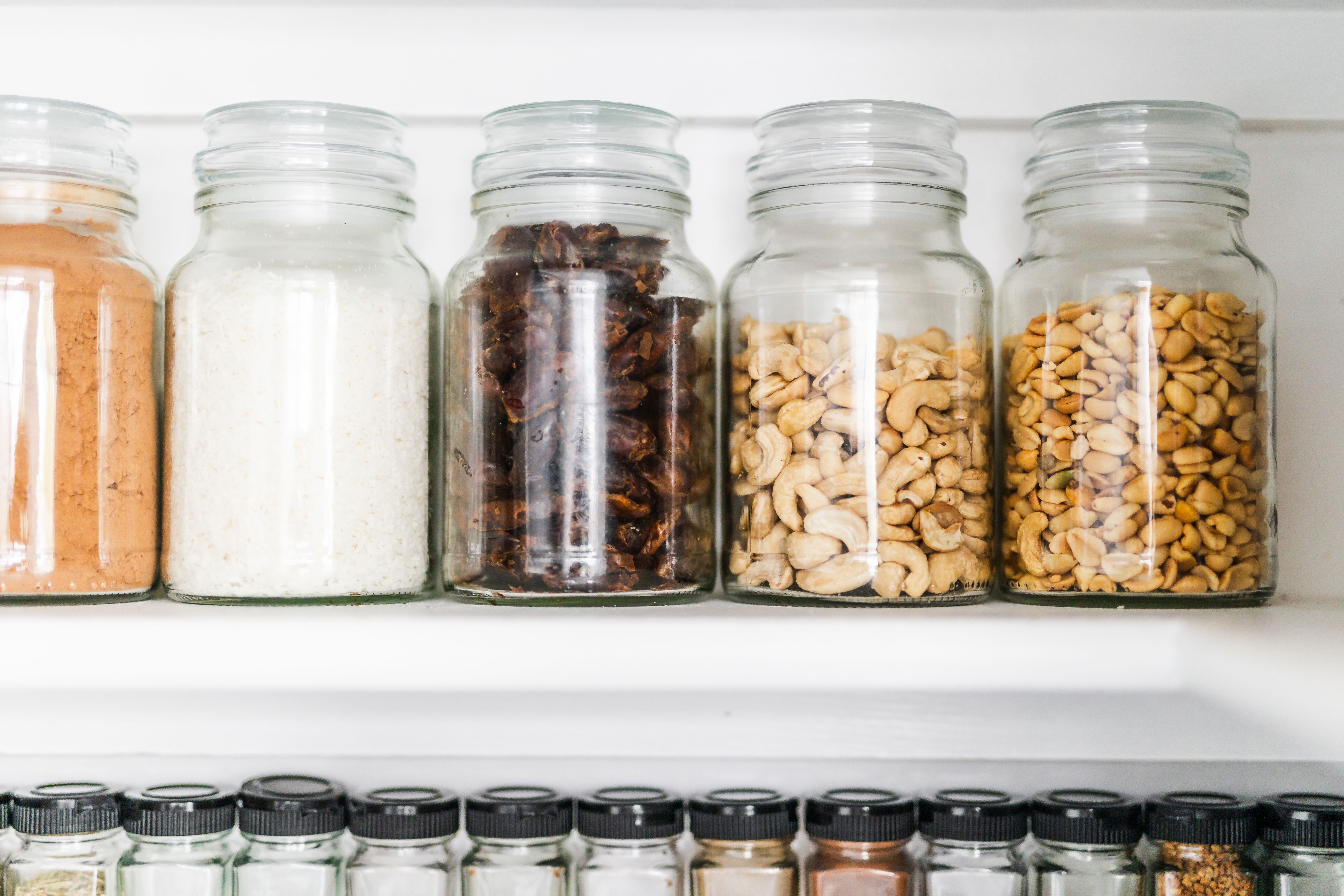 clear matching pantry jars with oats nuts and sweet ingredients in tidy organised aesthetic pantry shelf, food storage and beautiful organised home clear matching pantry jars with oats nuts and sweet ingredients in tidy organised aesthetic pantry shelf, food storage and beautiful organised home