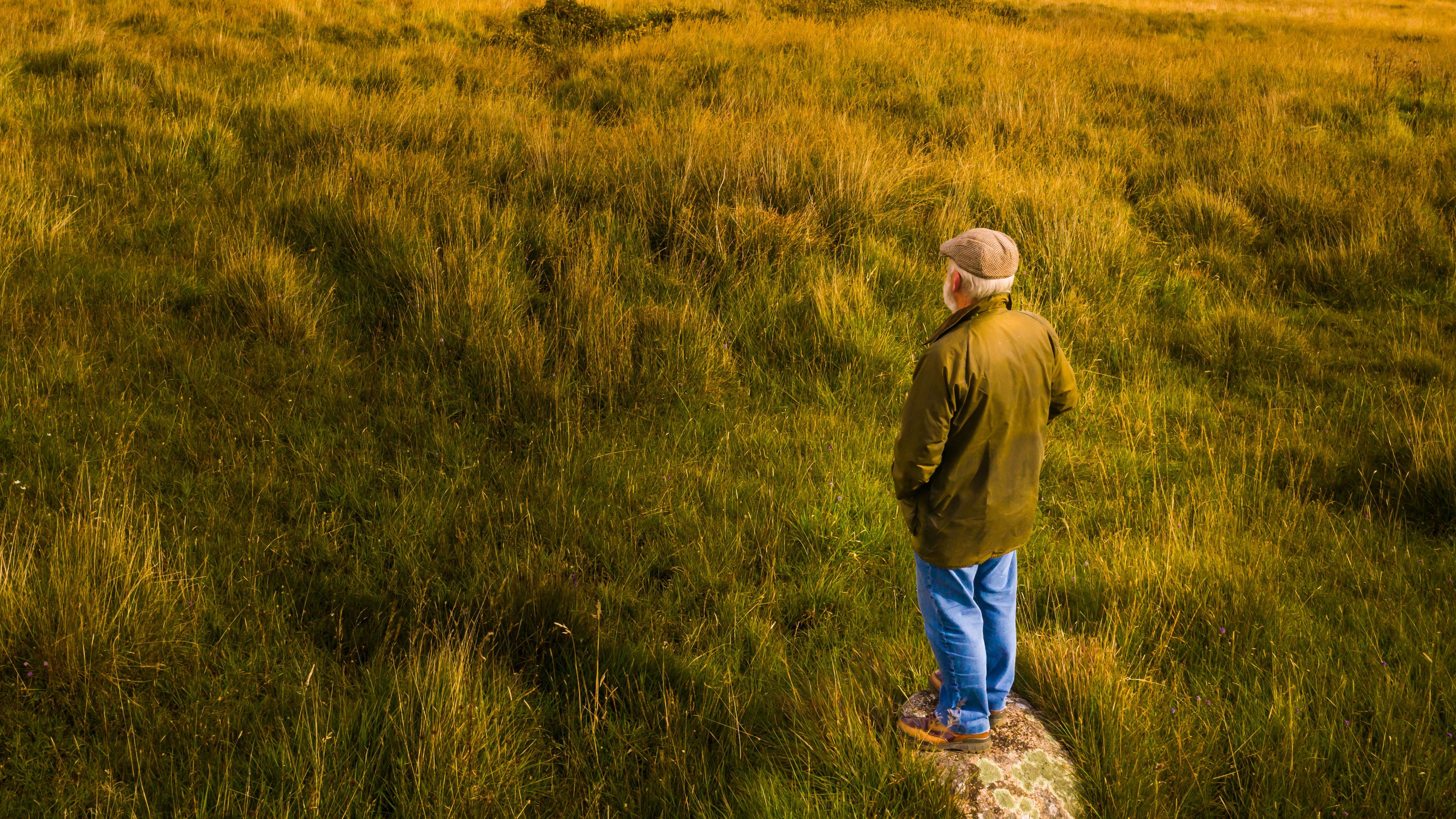 Senior man standing in the countryside of Dumfries and Galloway