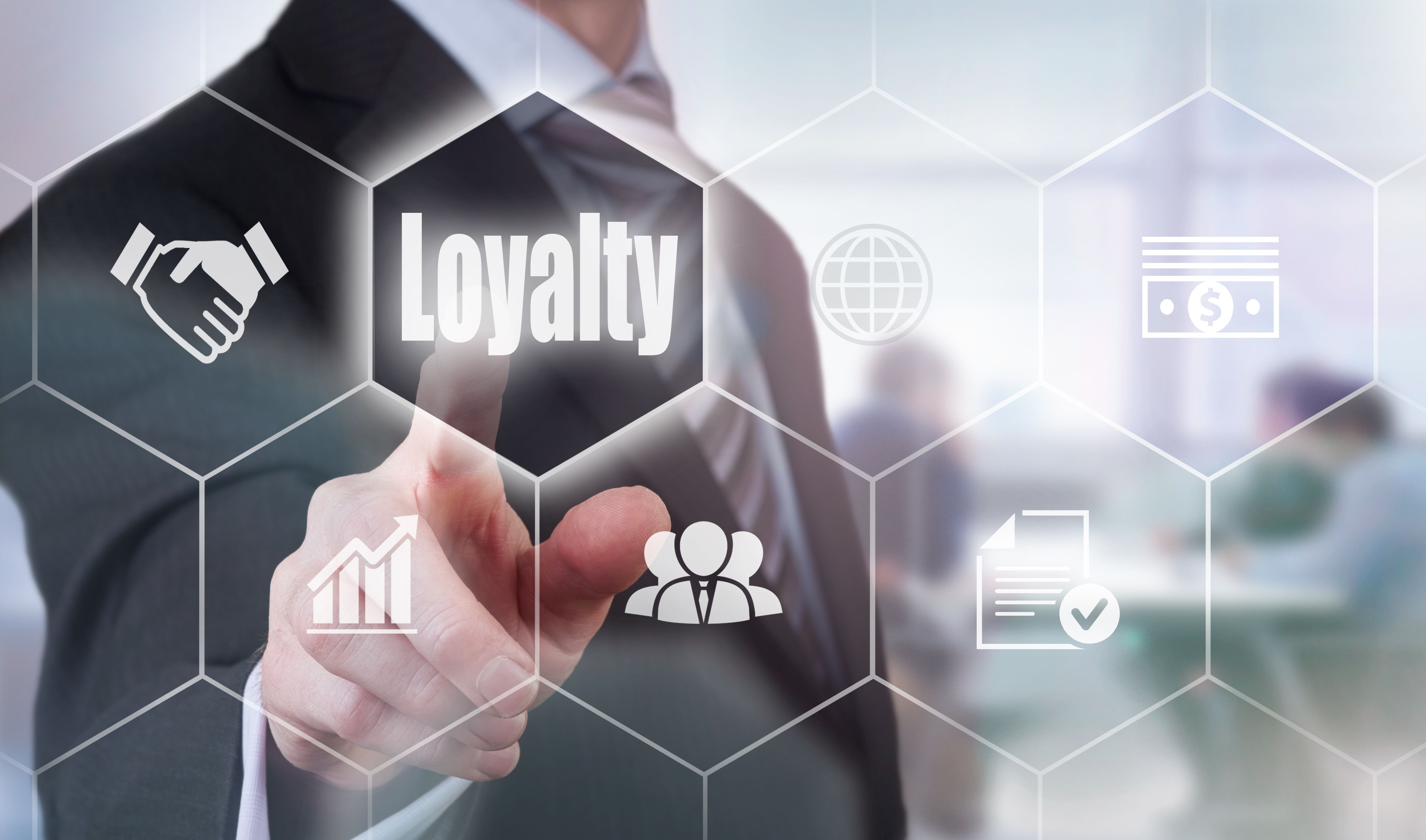 Businessman selecting a Loyalty Concept button