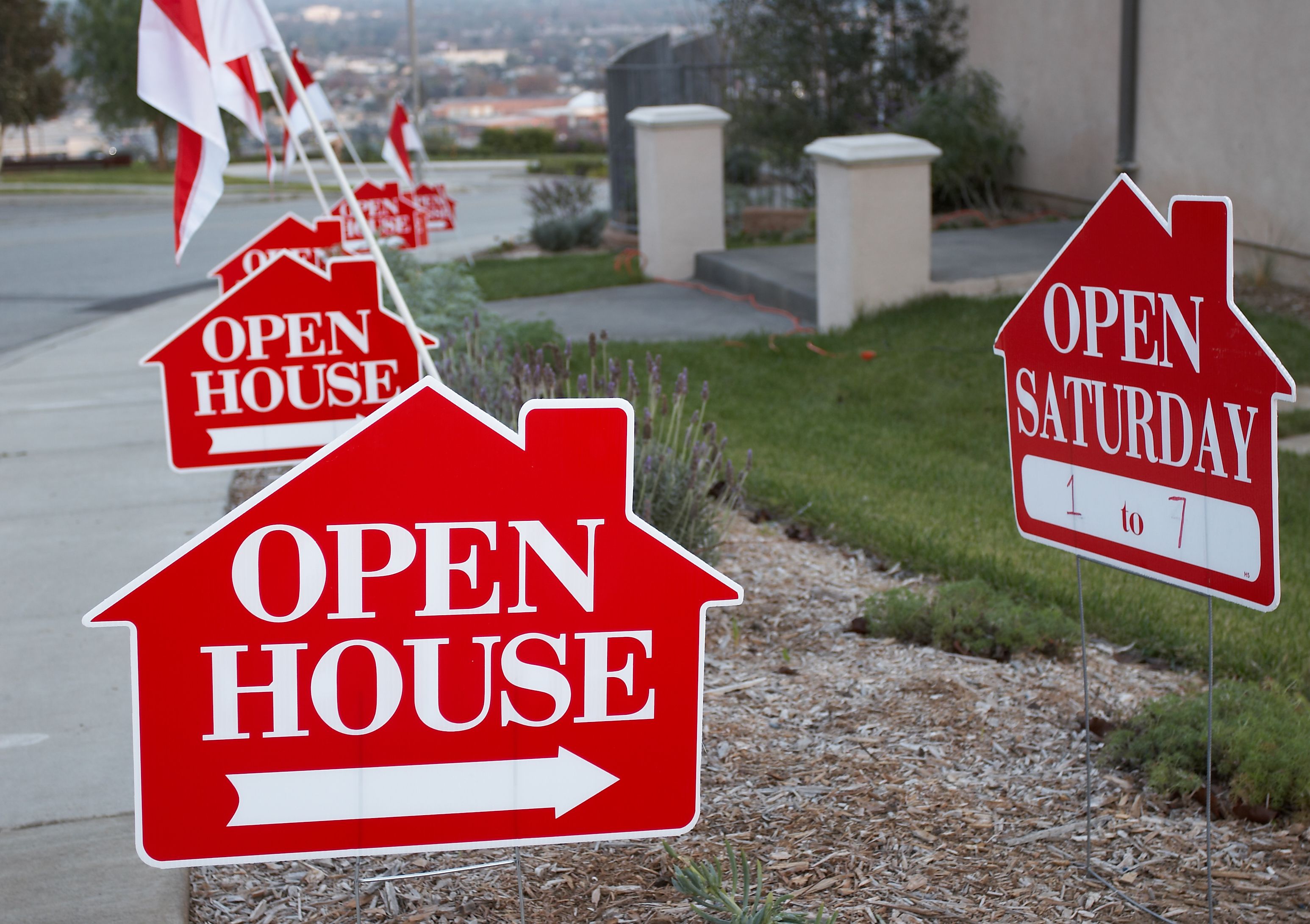 Red and white open house signs