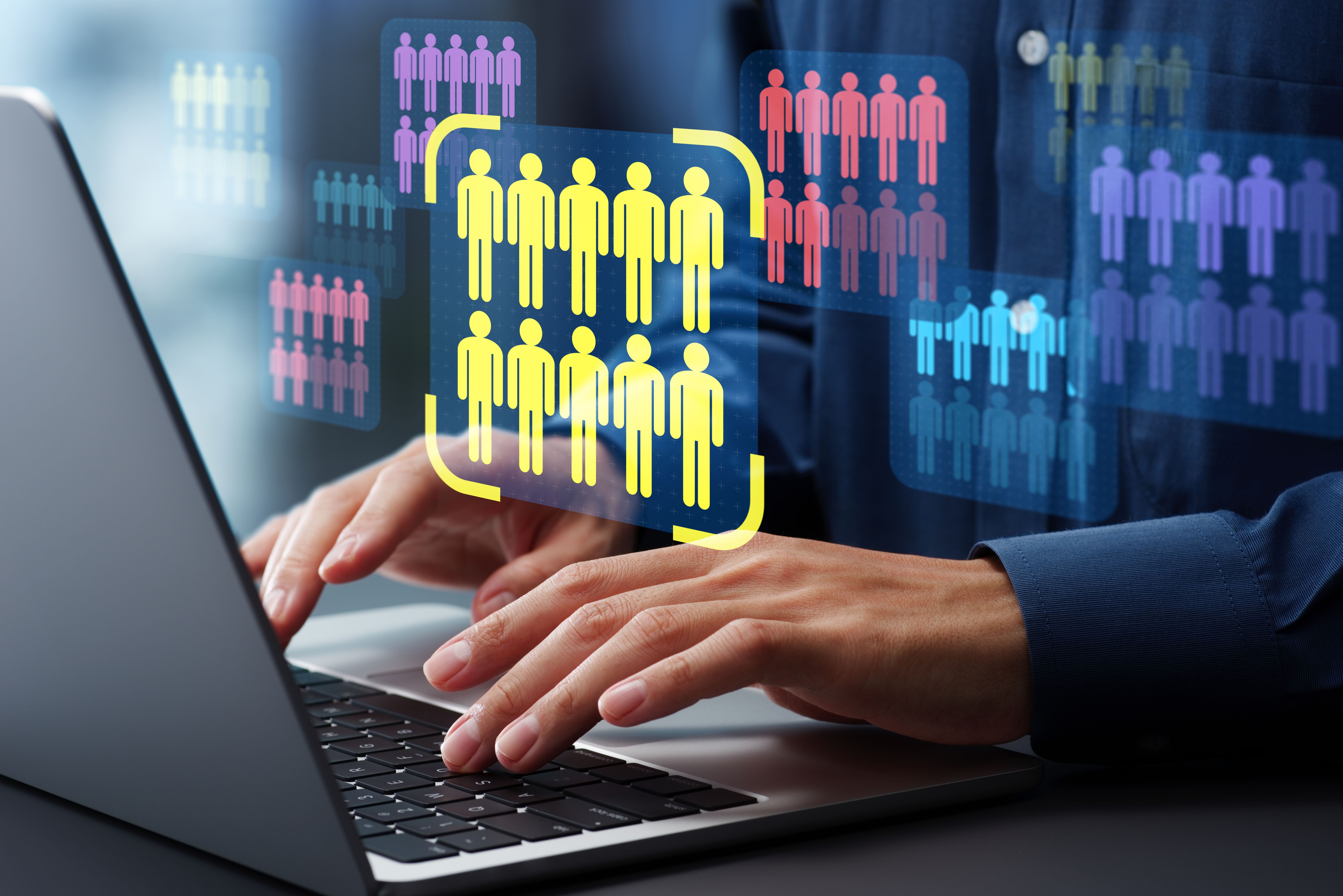 Target market or audience. Marketing segmentation strategy and analysis. Marketer using laptop computer to research customer data. Target market or audience. Marketing segmentation strategy and analysis. Marketer using laptop computer to research customer data.