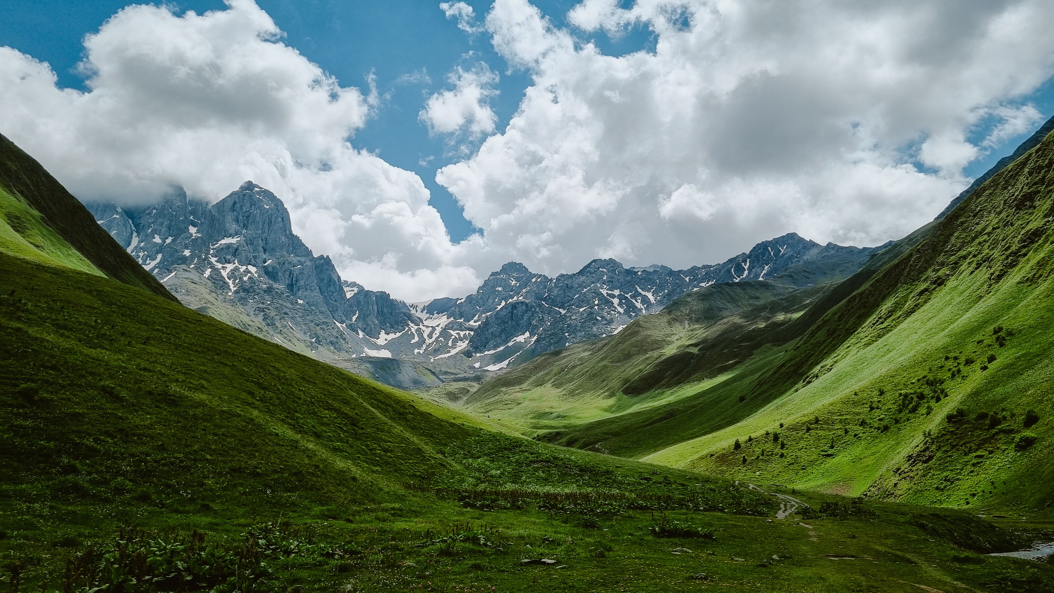 Mountain landscape with a view of the valley and Mount Chaukhi. Juta georgia, beautiful sky and rock