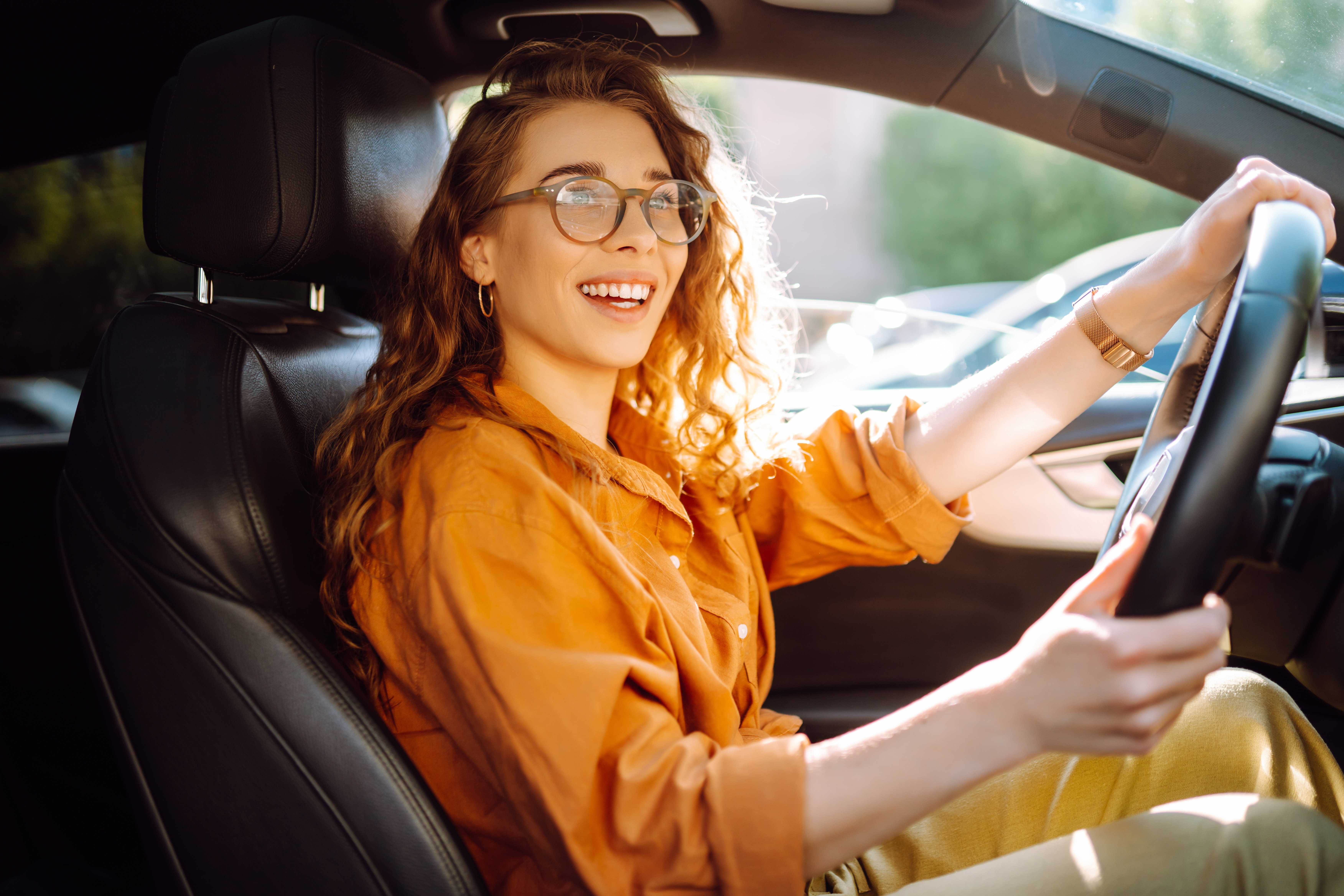 Stylish woman driving a car. Stylish woman driving a car.
