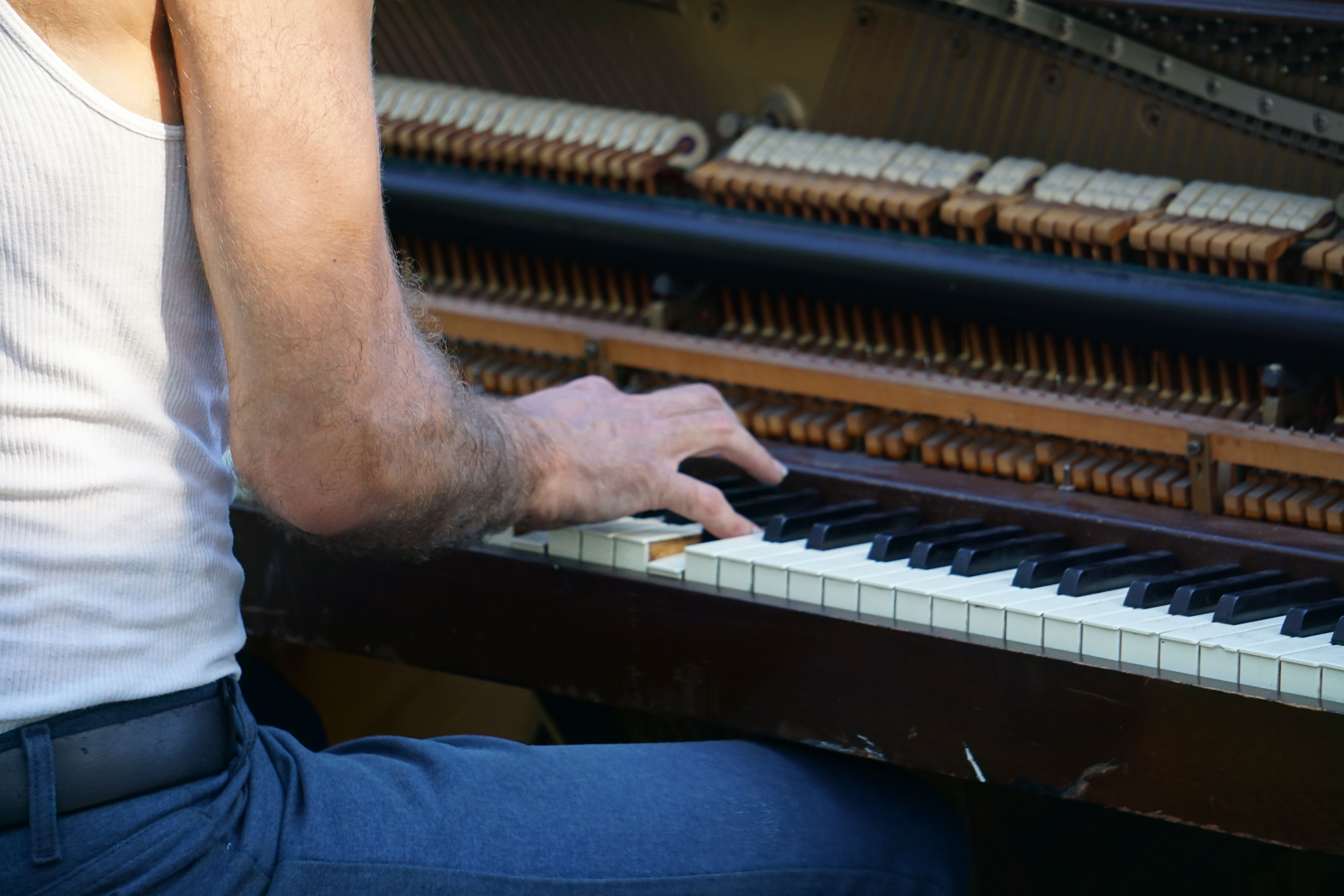 Midsection Of Man Playing Piano