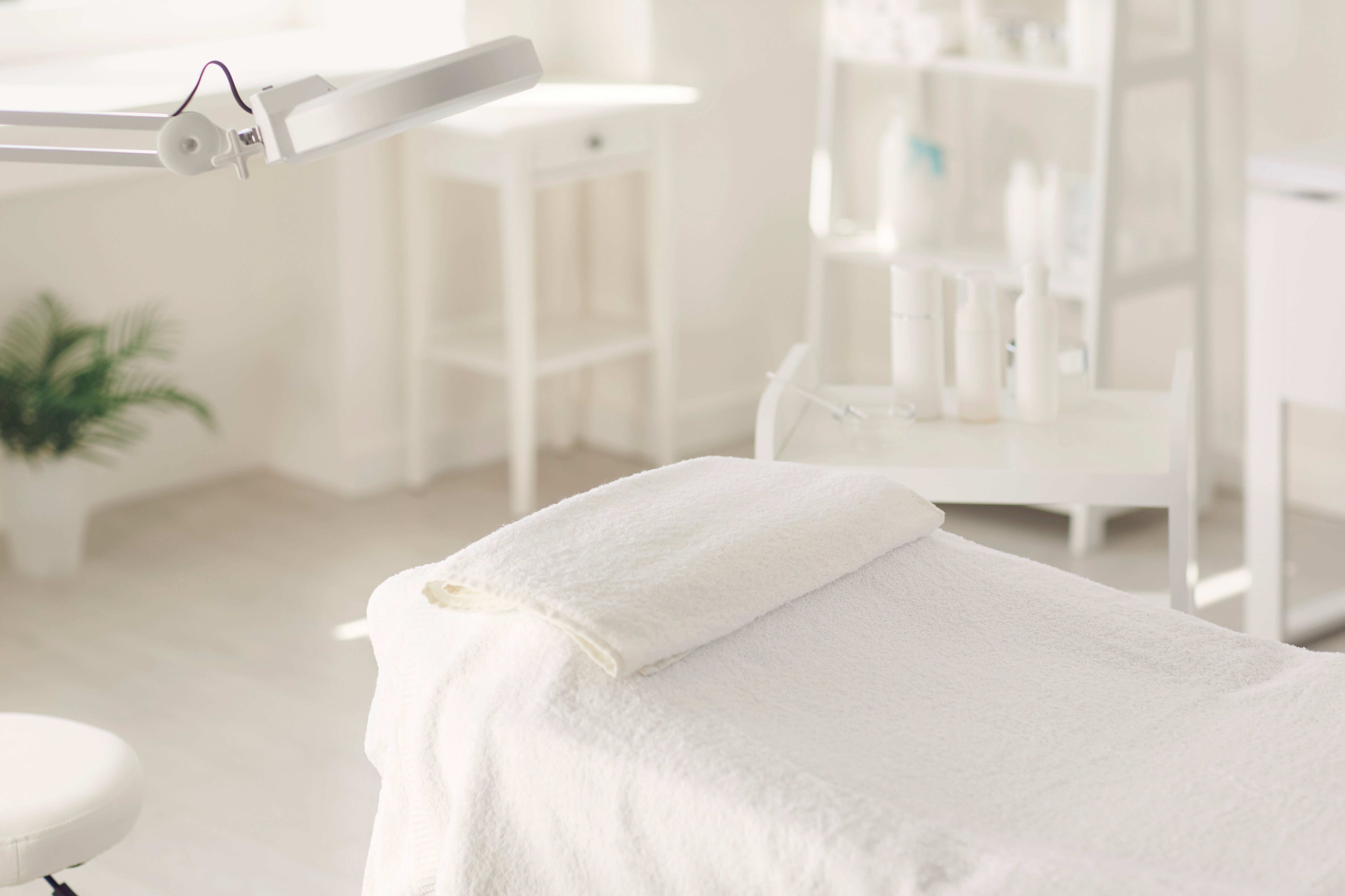 The interior of the beauty salon. Workplace of a cosmetologist maasagist. White dermatologist office.