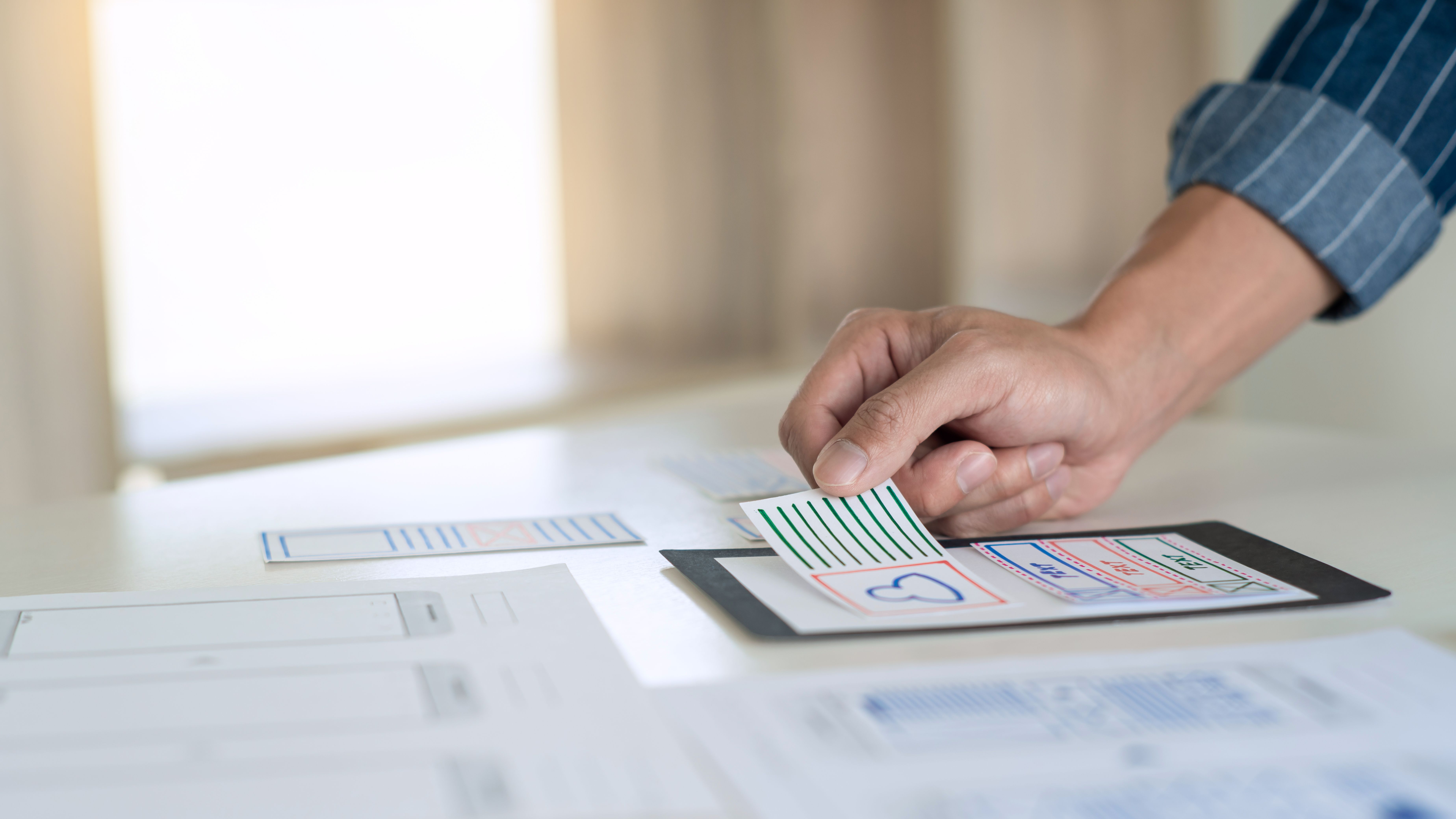 ux designer creative planning application development near layouts of mobile smartphone frameworks, User experience concept