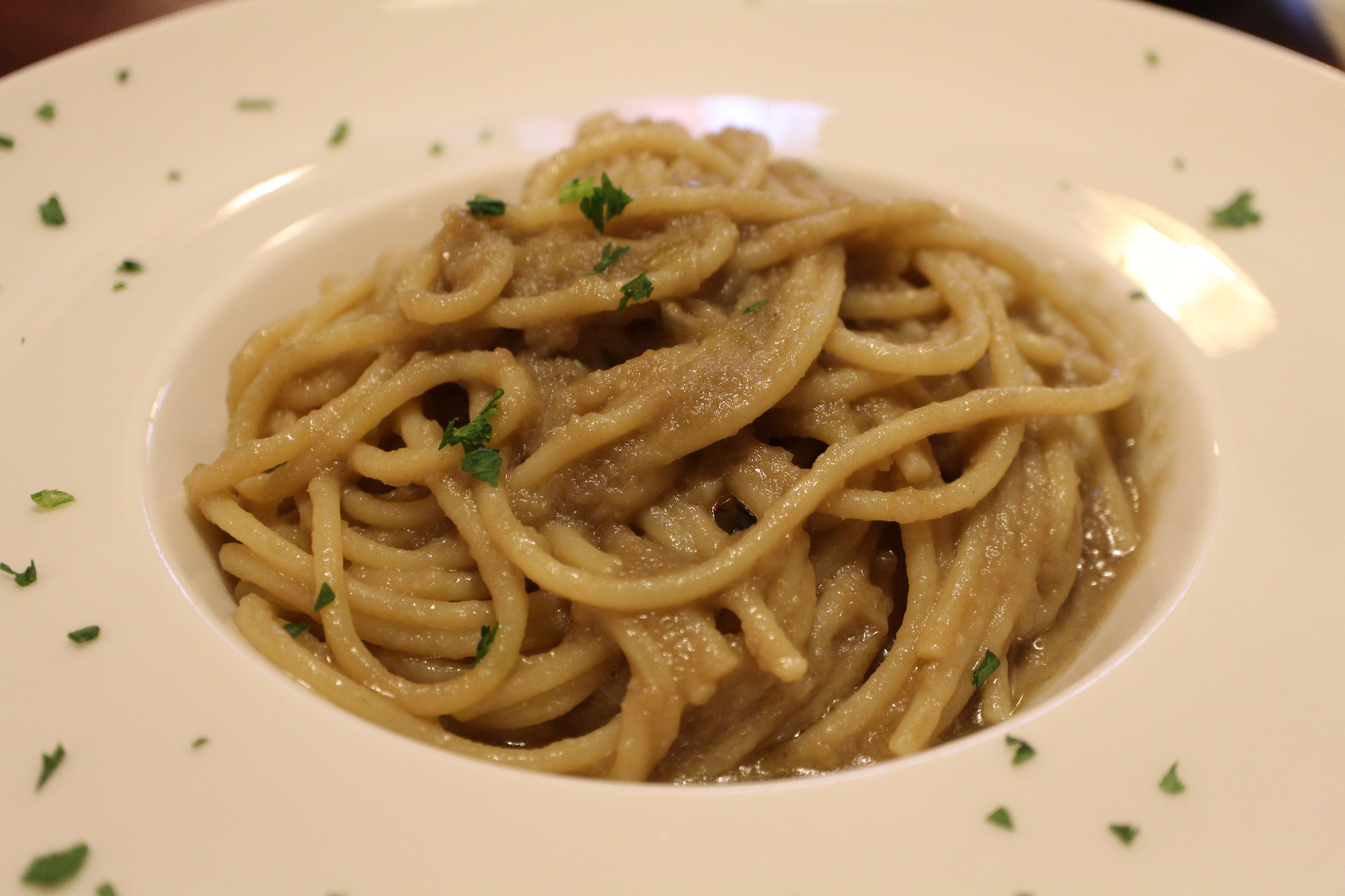 Italian cuisine: bigoli in salsa (bigoli basta with anchovies and onions) in Venice, Italy