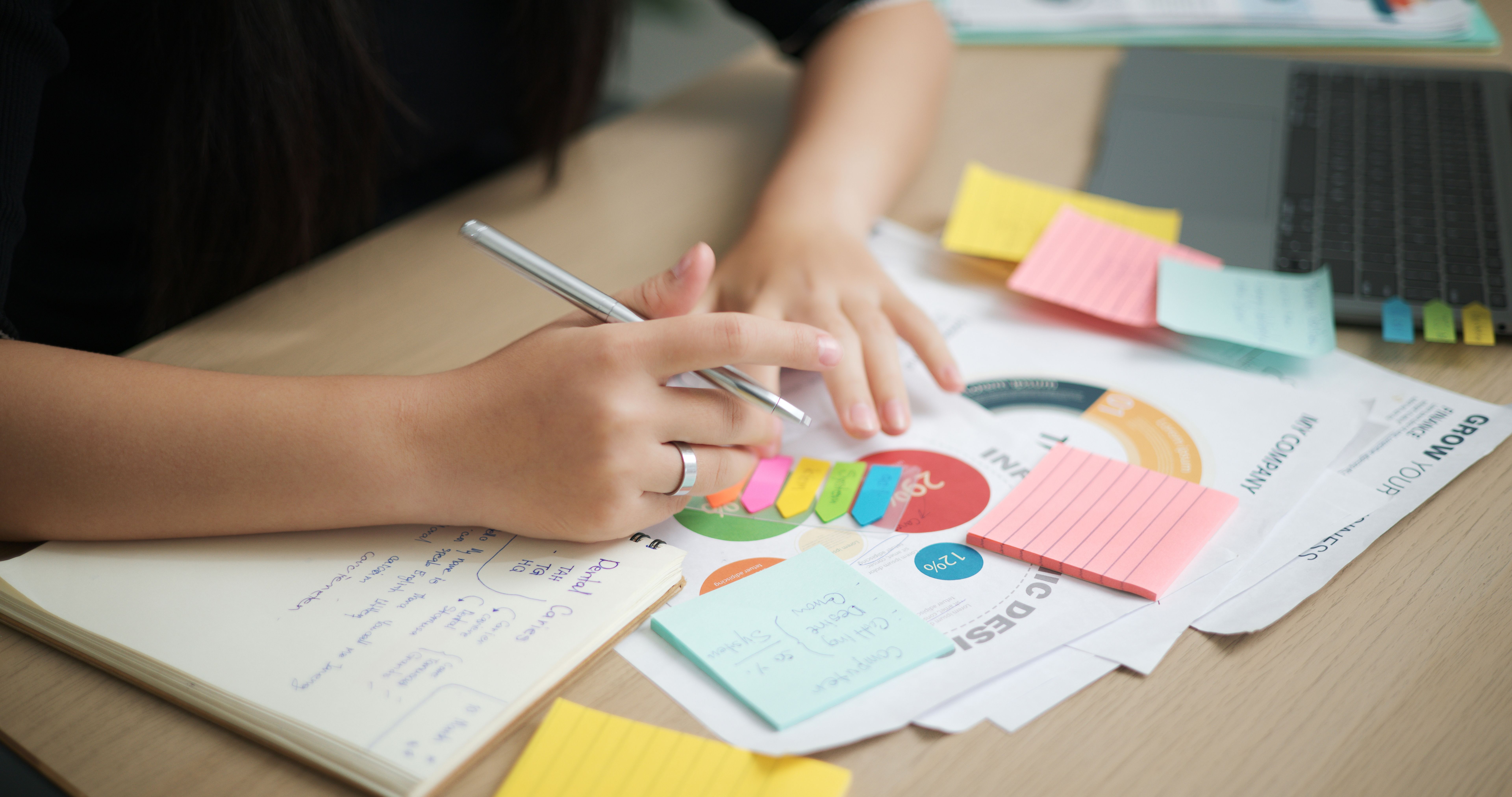 person brainstorming on paper