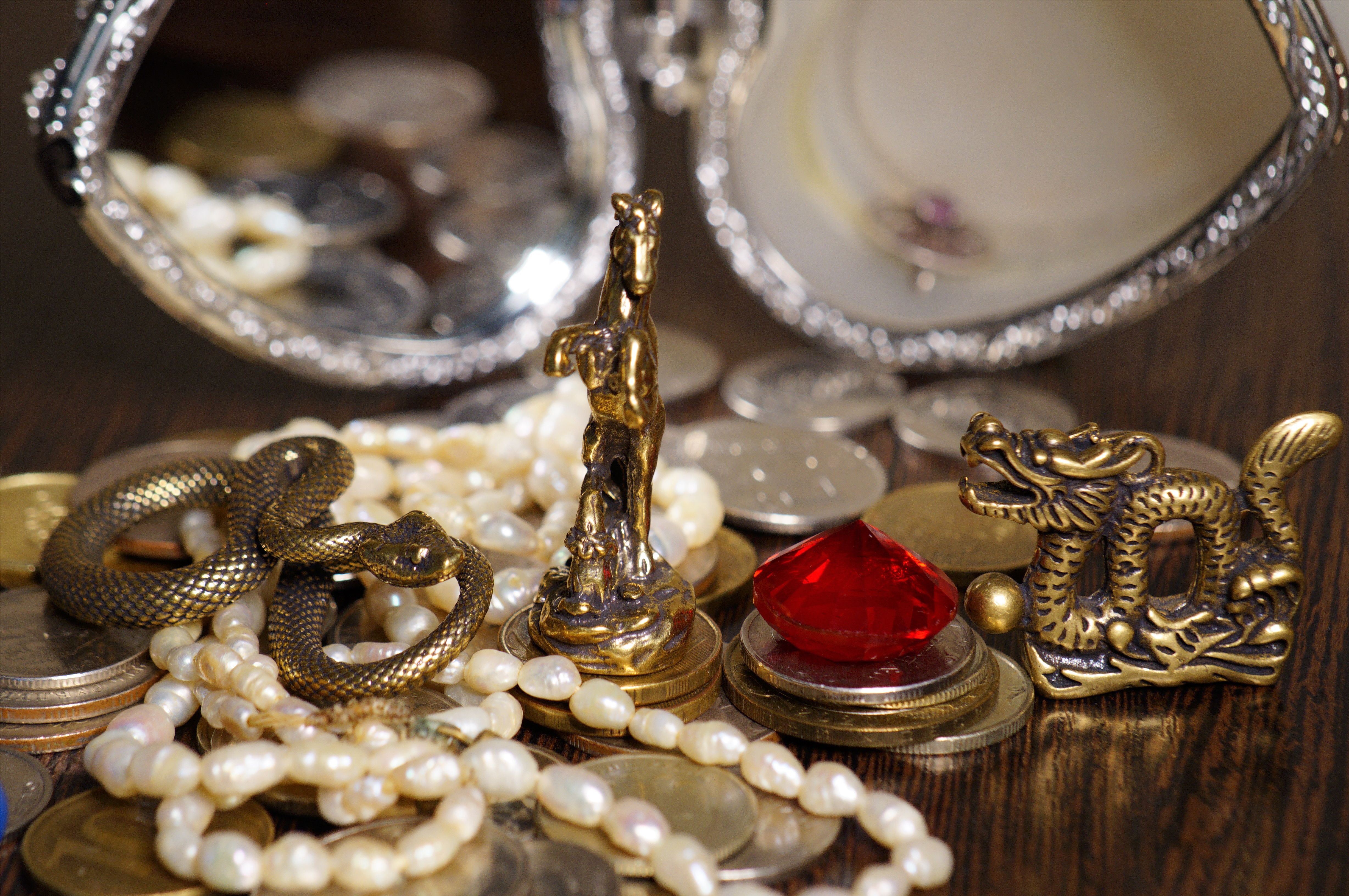 A statuette of a snake, a horse and a dragon.