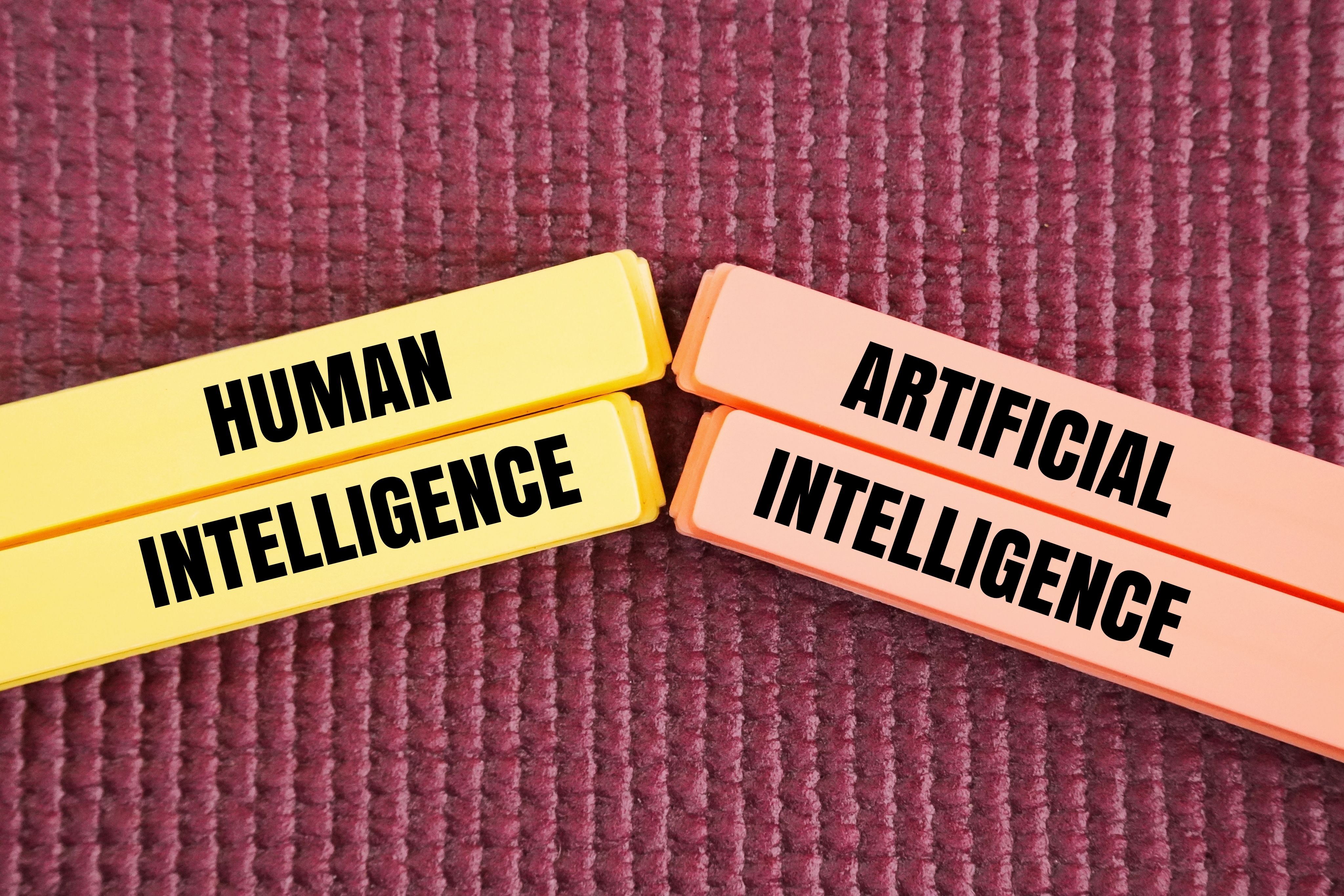 words human intelligence vs. artificial intelligence.