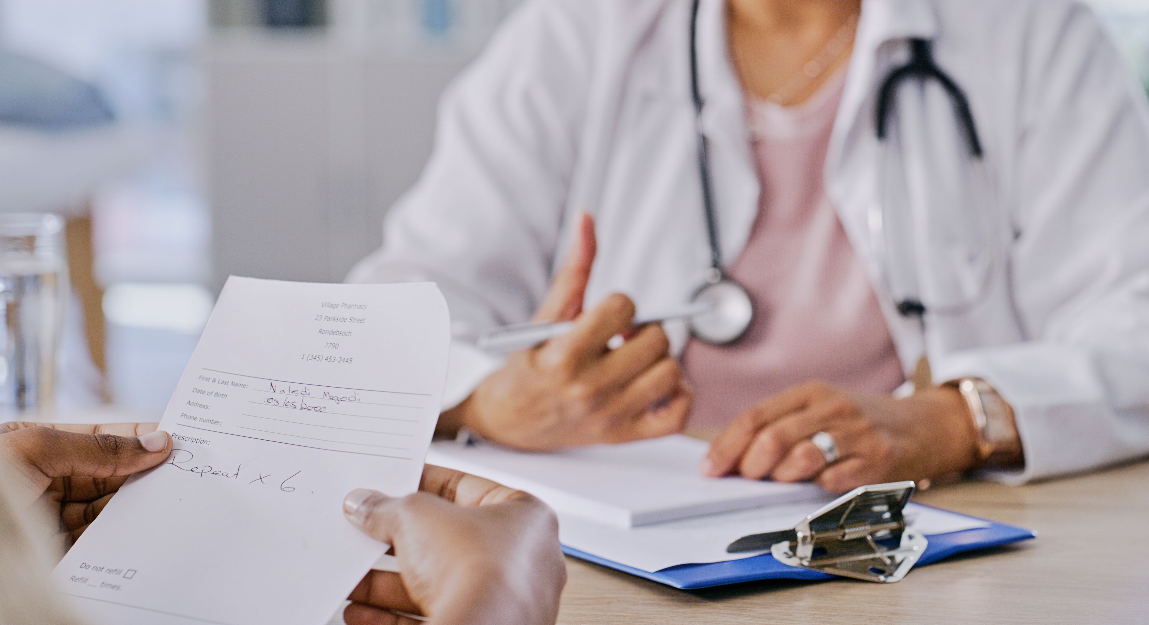 Hands, document and medicine prescription from doctor with patient for treatment or health insurance at hospital. Healthcare, paperwork and people in office, diagnosis and results with medical script