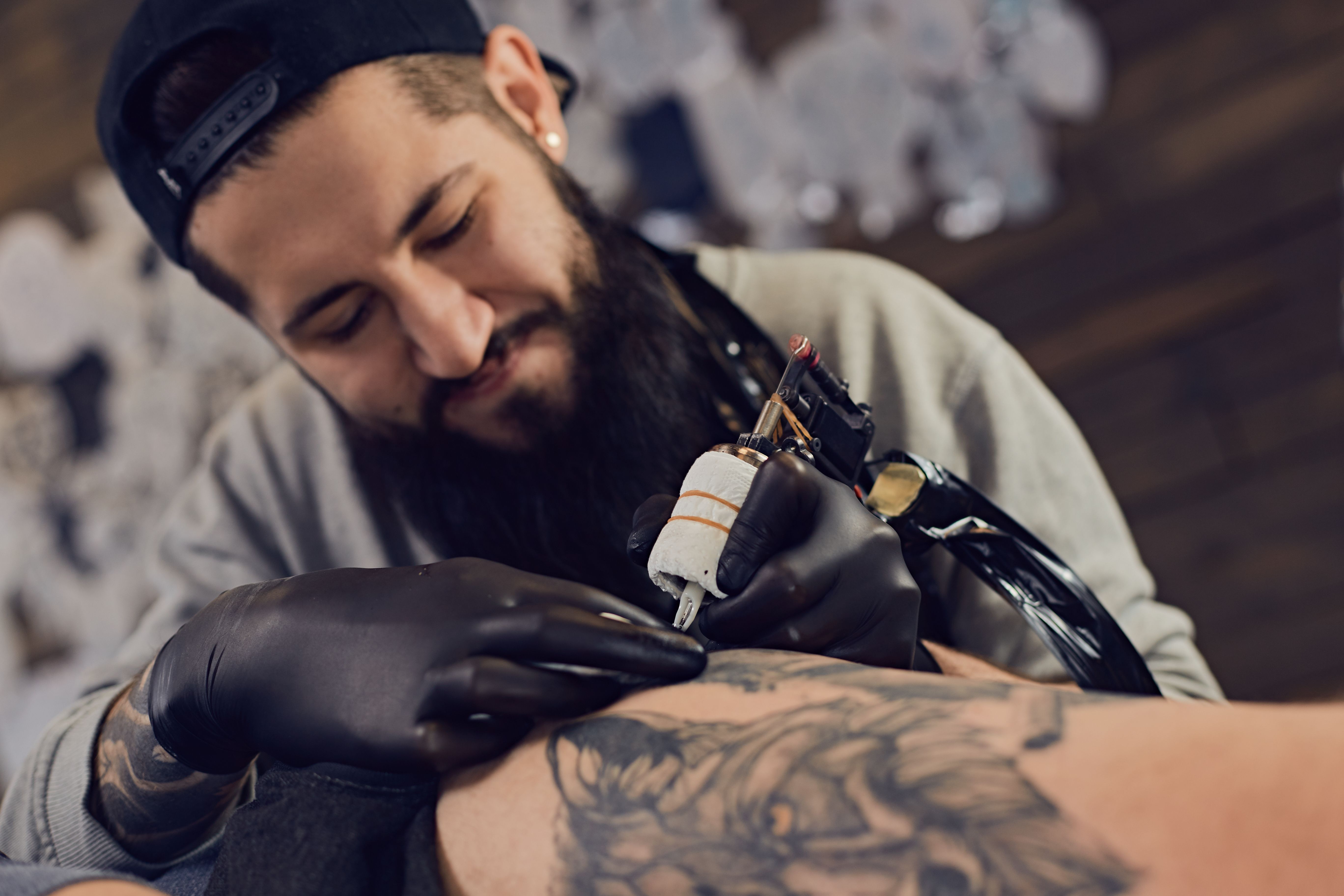 tattoo artist working