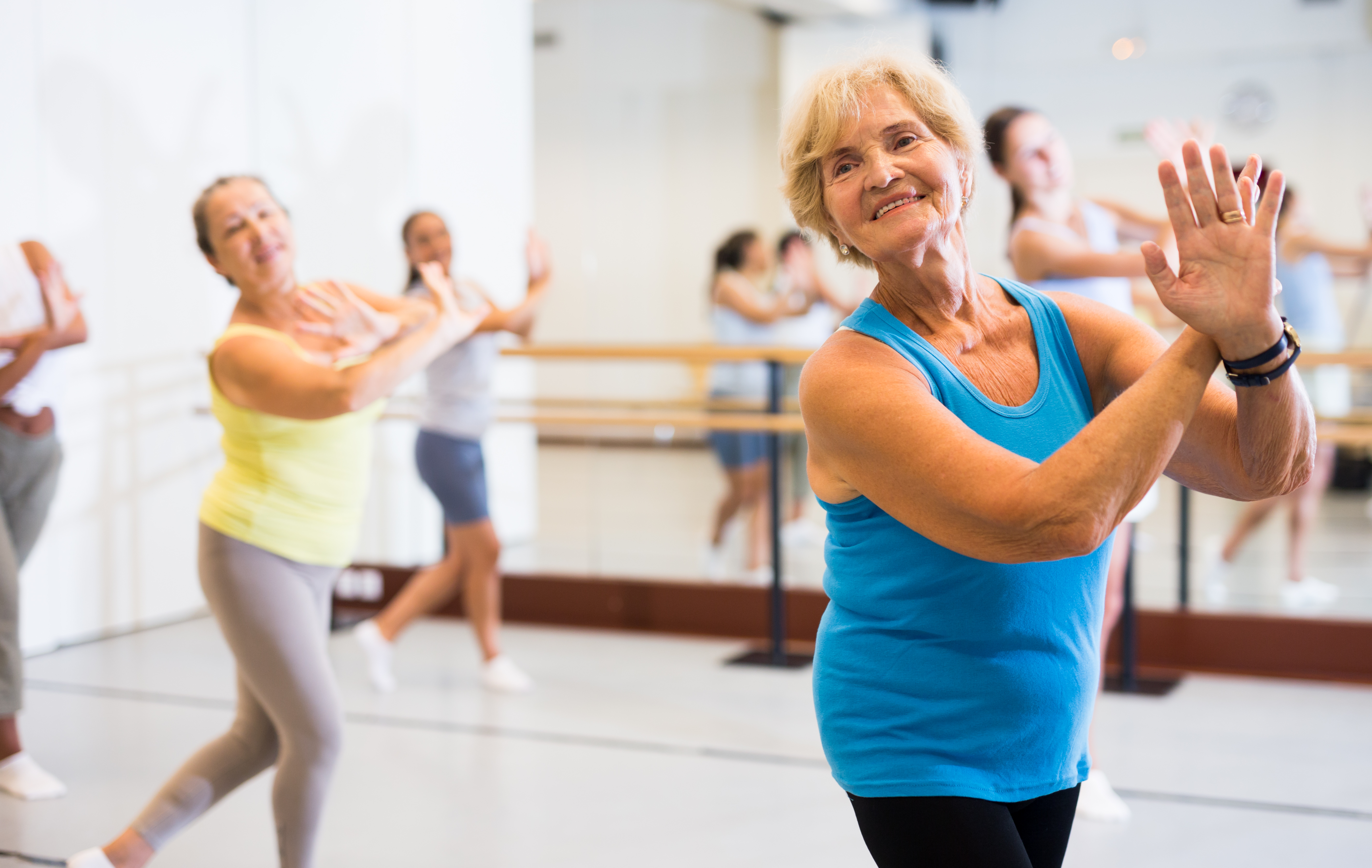 Portrait of an mature European woman enjoying energetic dancing in the studio Portrait of an mature European woman enjoying energetic dancing in the studio