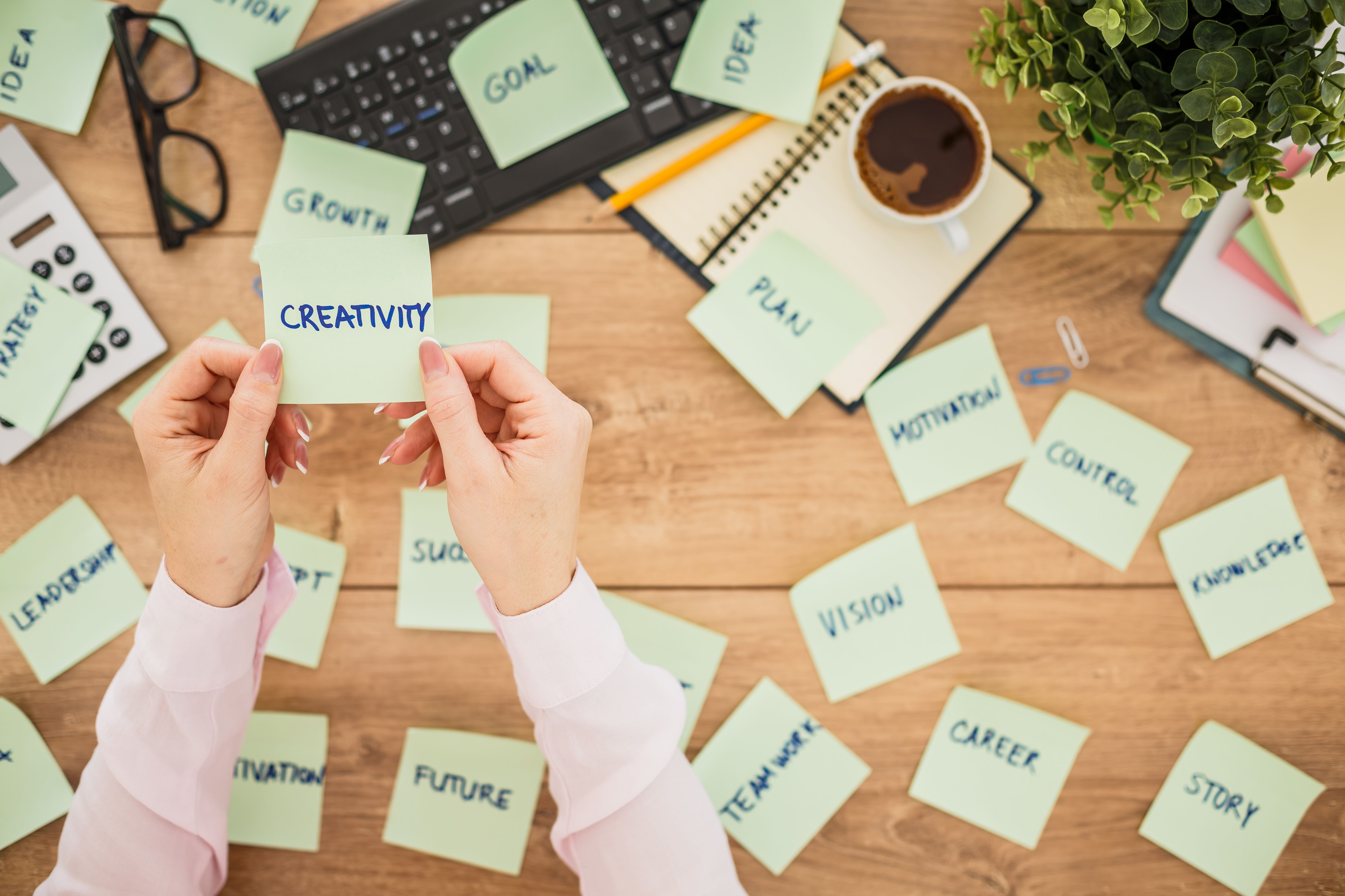 Sticky notes with keywords to a successful business scattered on a office desk Sticky notes with keywords to a successful business scattered on a office desk