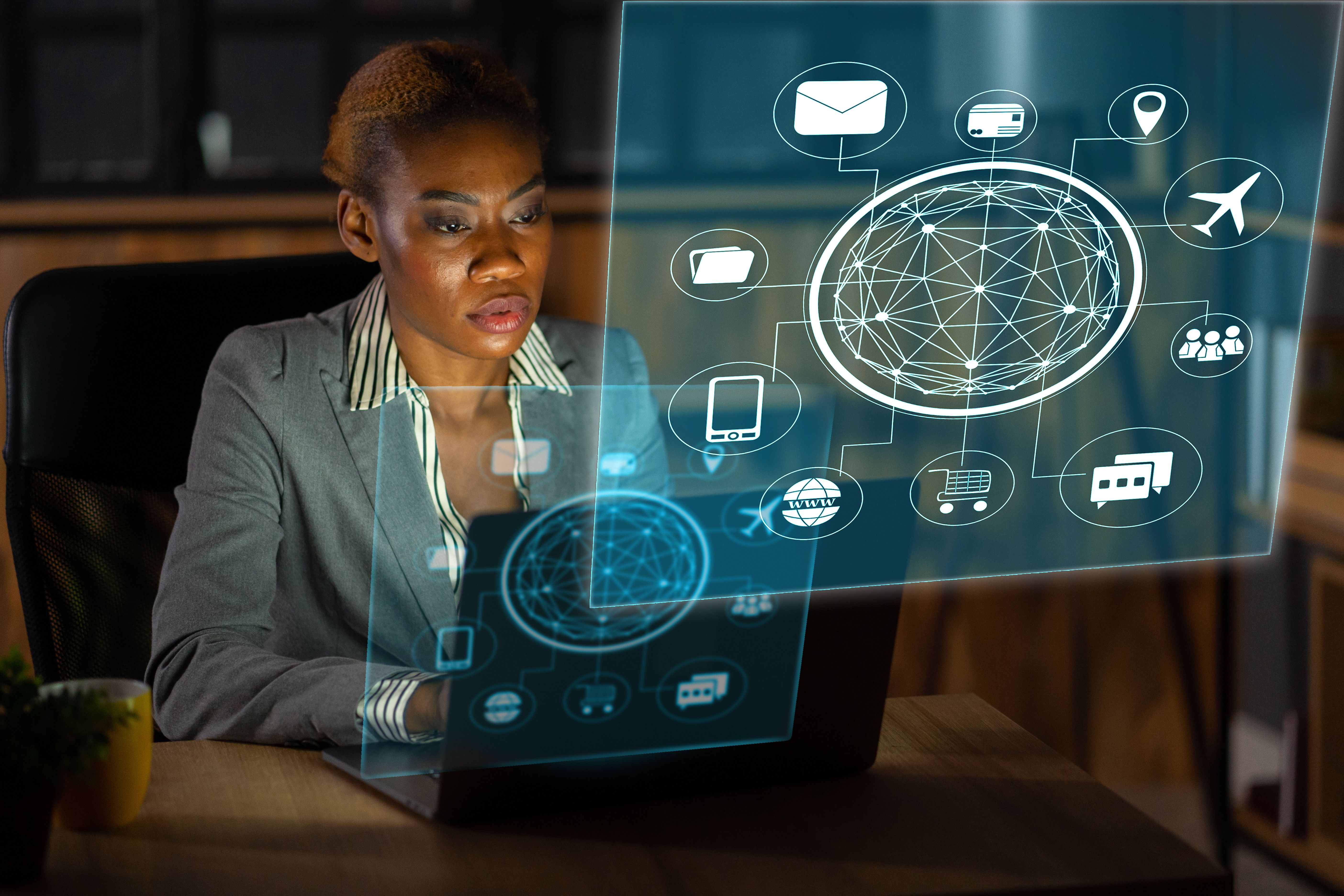 An african descent woman working with hologram technology An african descent woman working with hologram technology