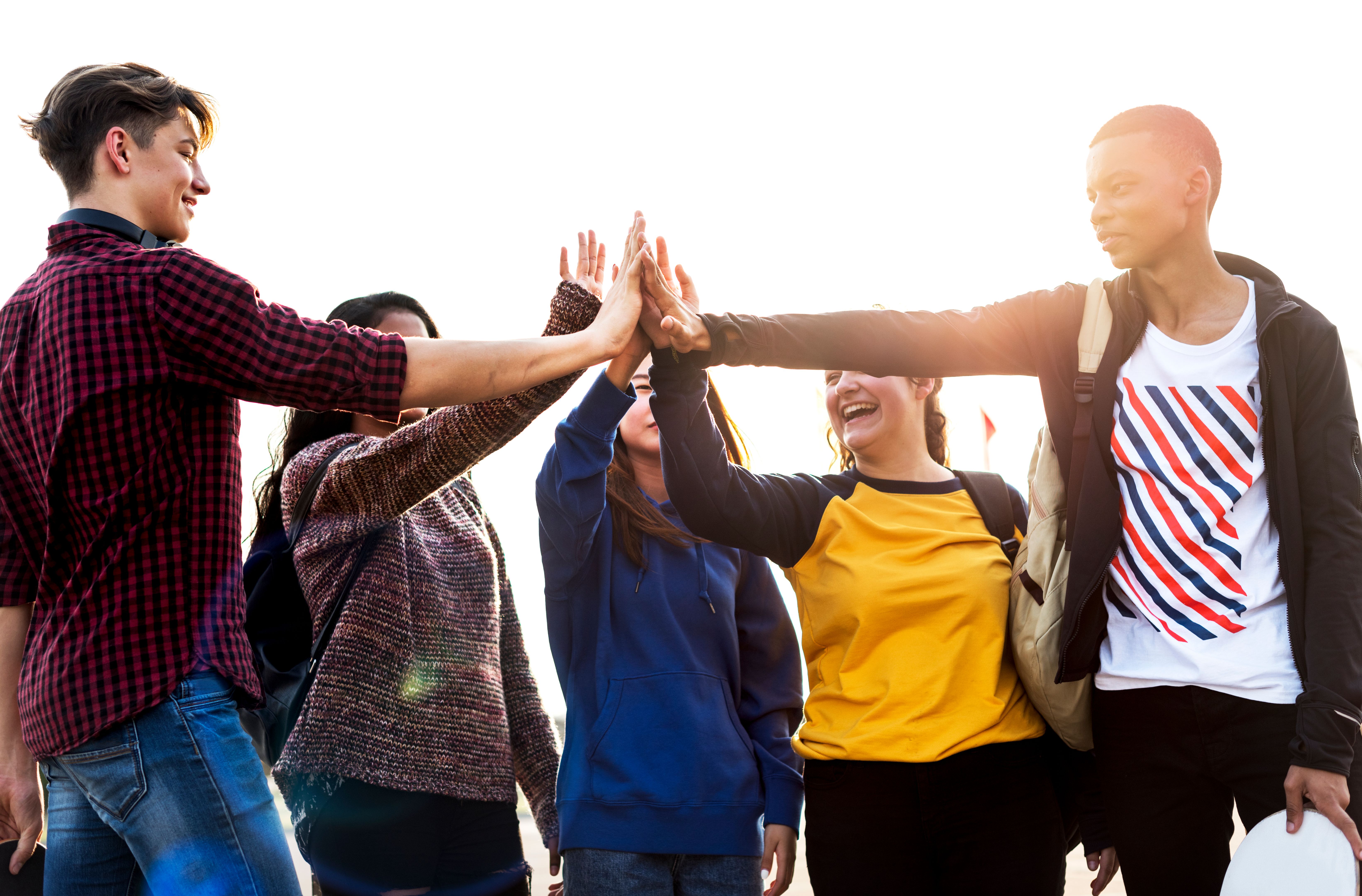 Group of friends all high five together support and teamwork concept