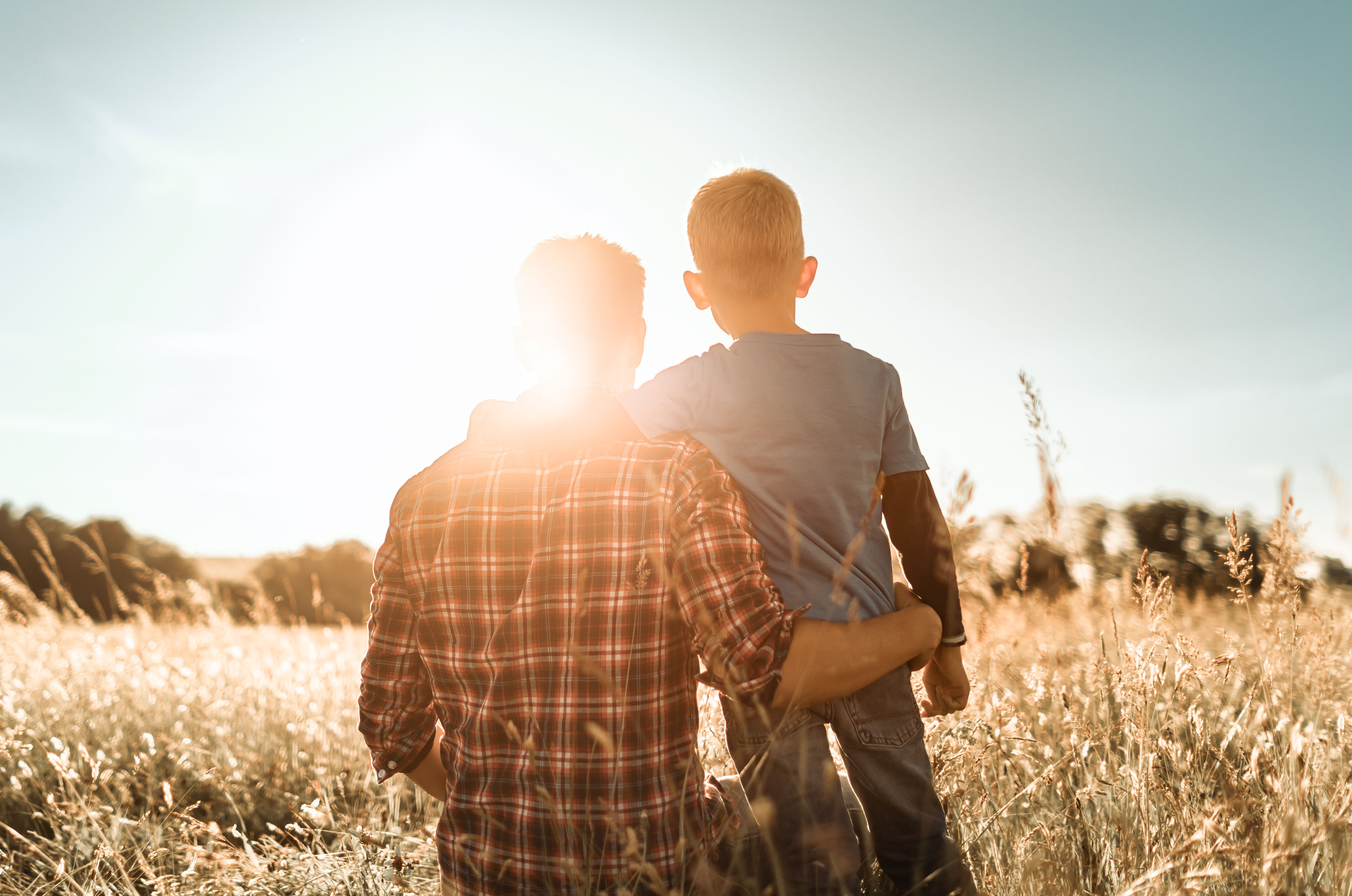 Father and son in a nature setting. Father and son in a nature setting.