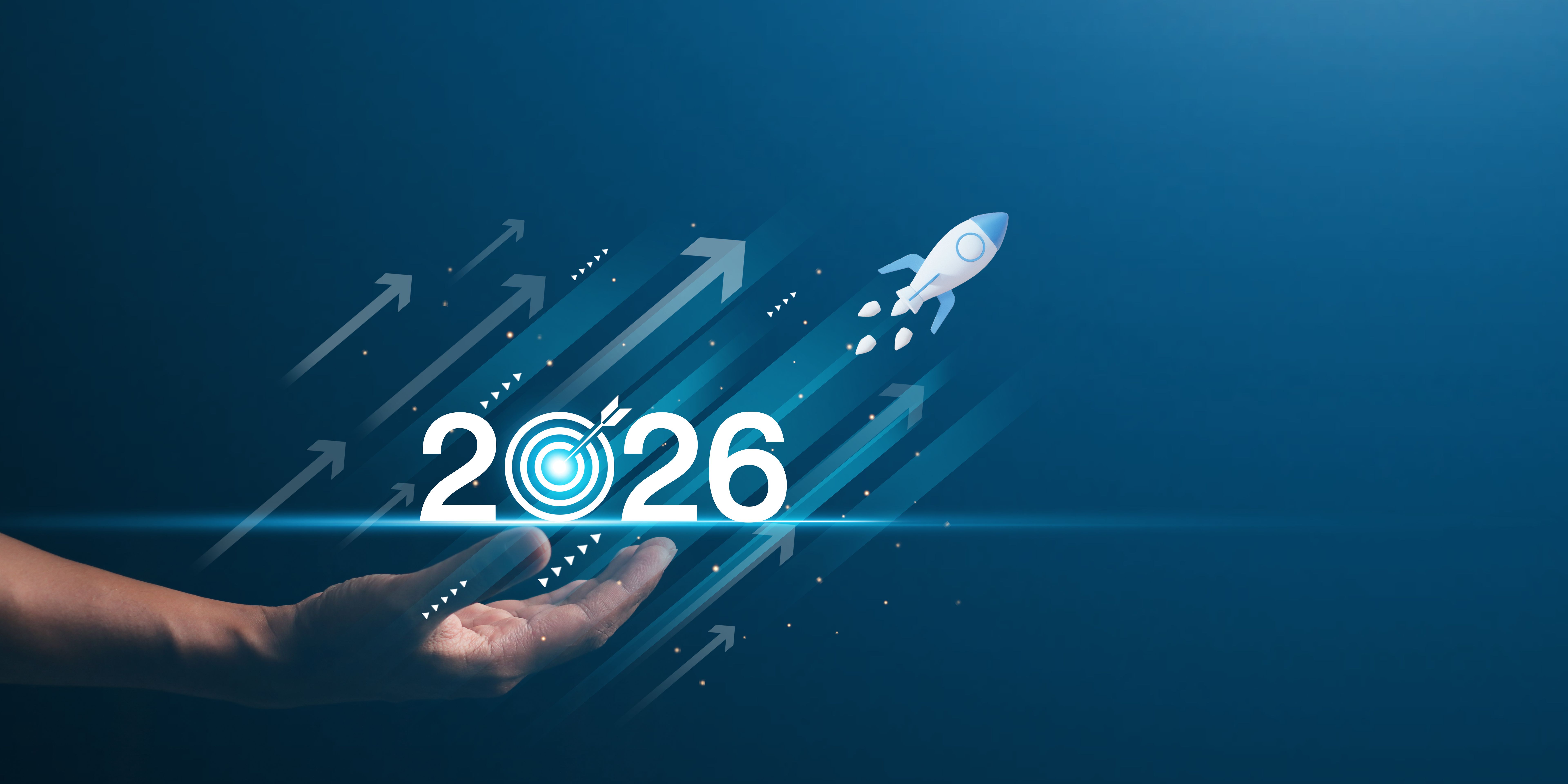 Businessman hand presenting with digital 2026 goal, rocket launch and upward arrows. Futuristic concept of business growth, digital strategy, and vision planning.
