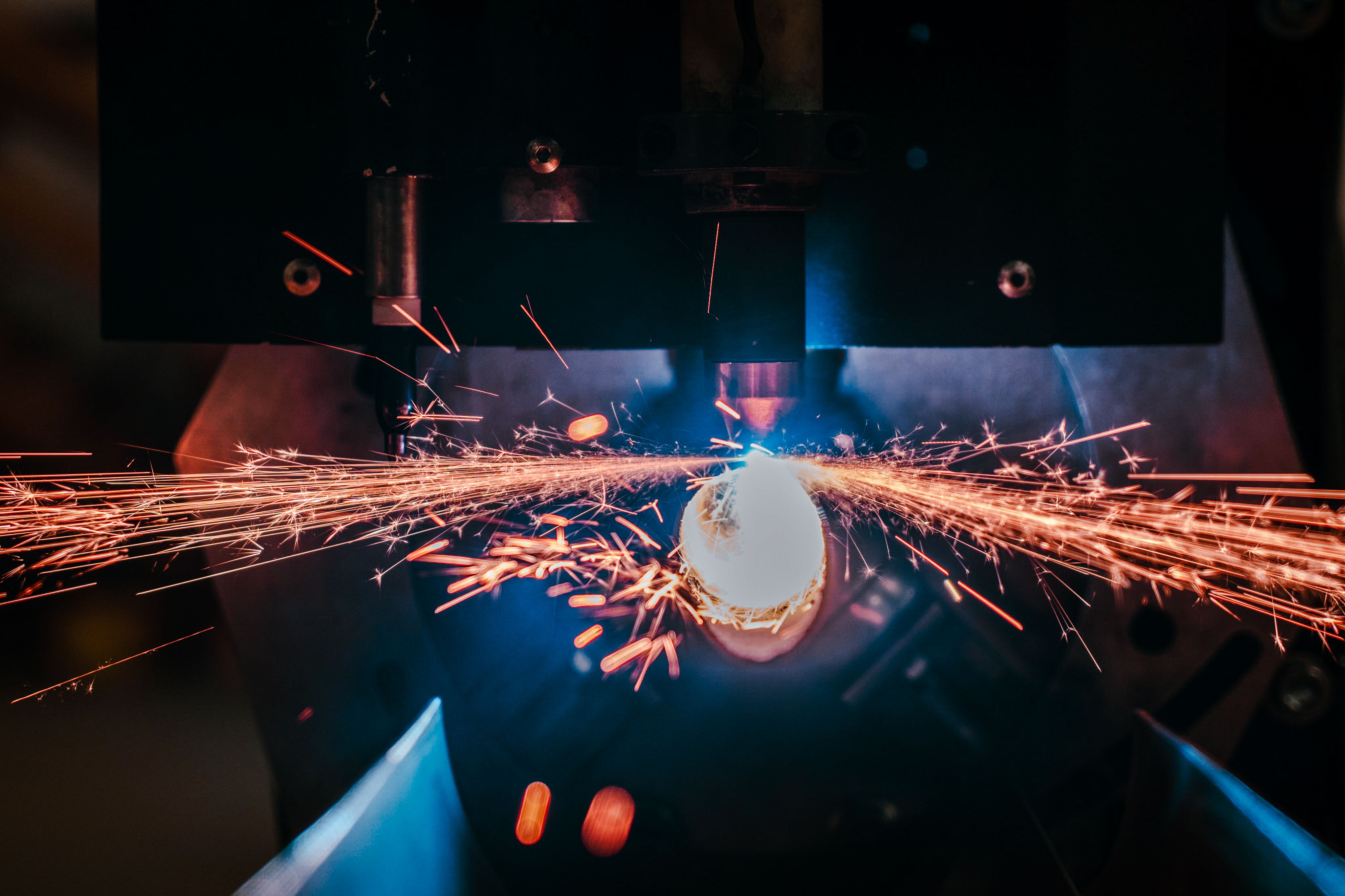 High-Precision Robotic Welding Machine Emitting Intense Sparks and Blue Light, USA