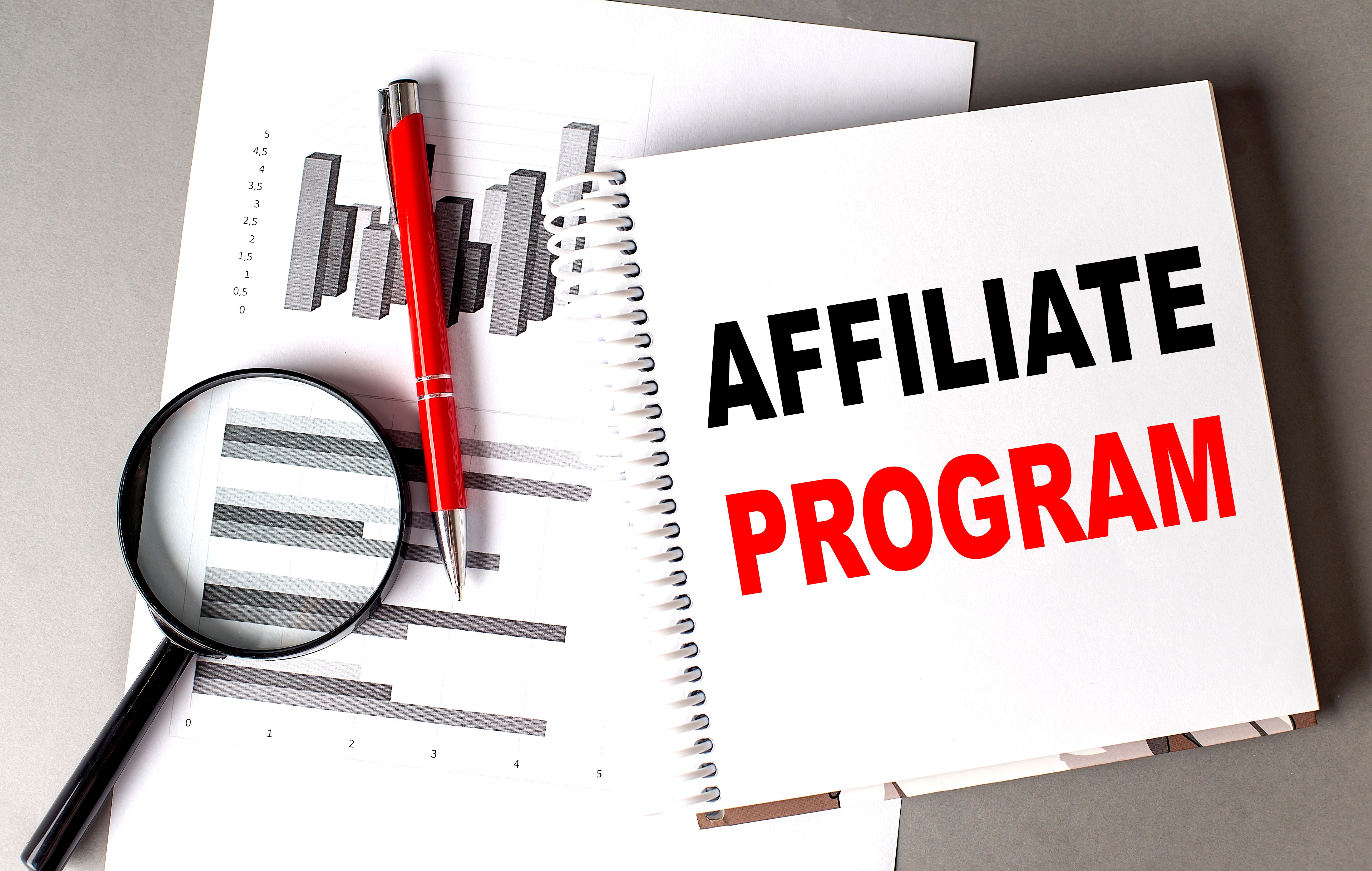 AFFILIATE PROGRAM text written on notebook with chart