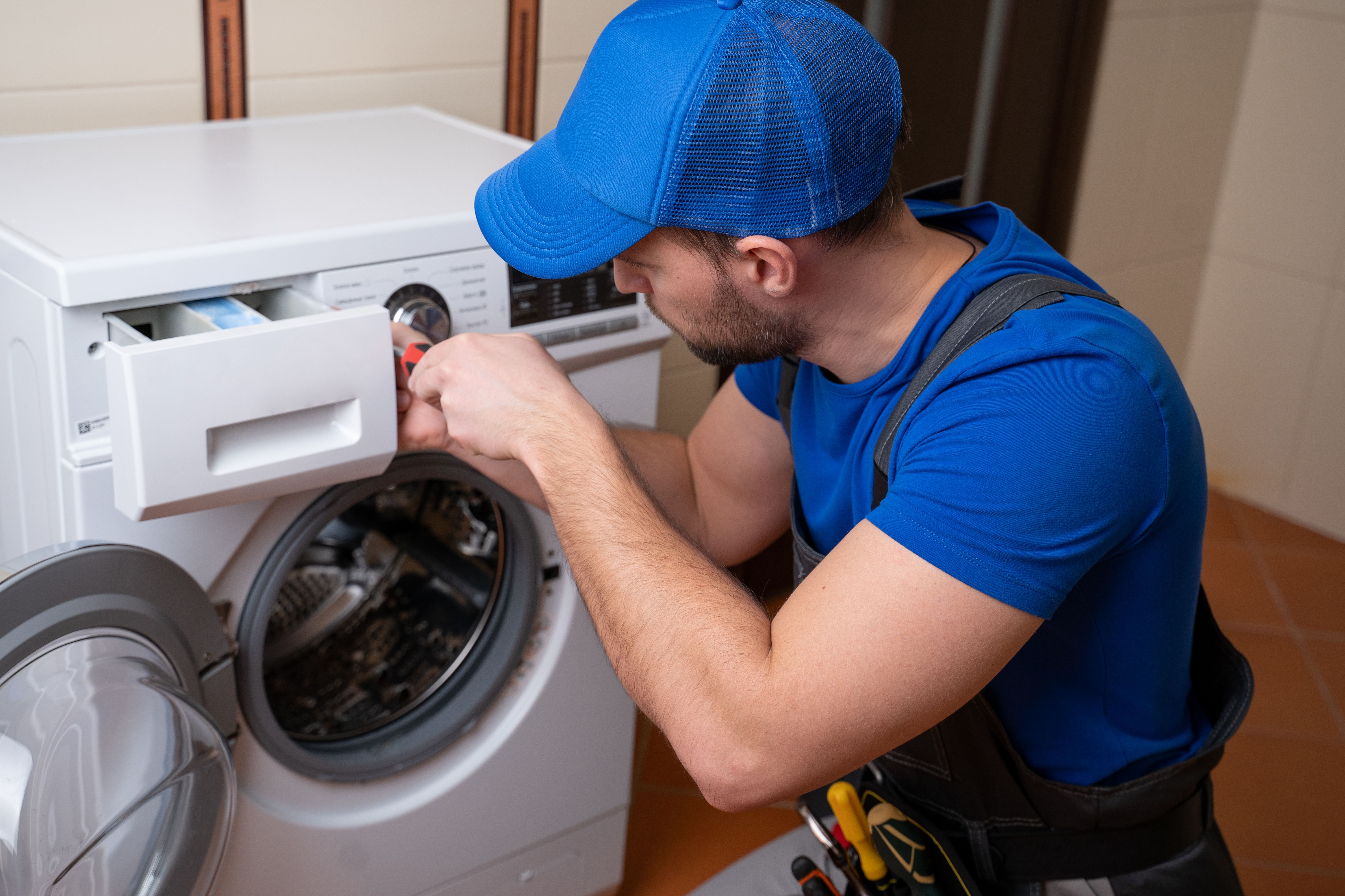technician fixing appliance