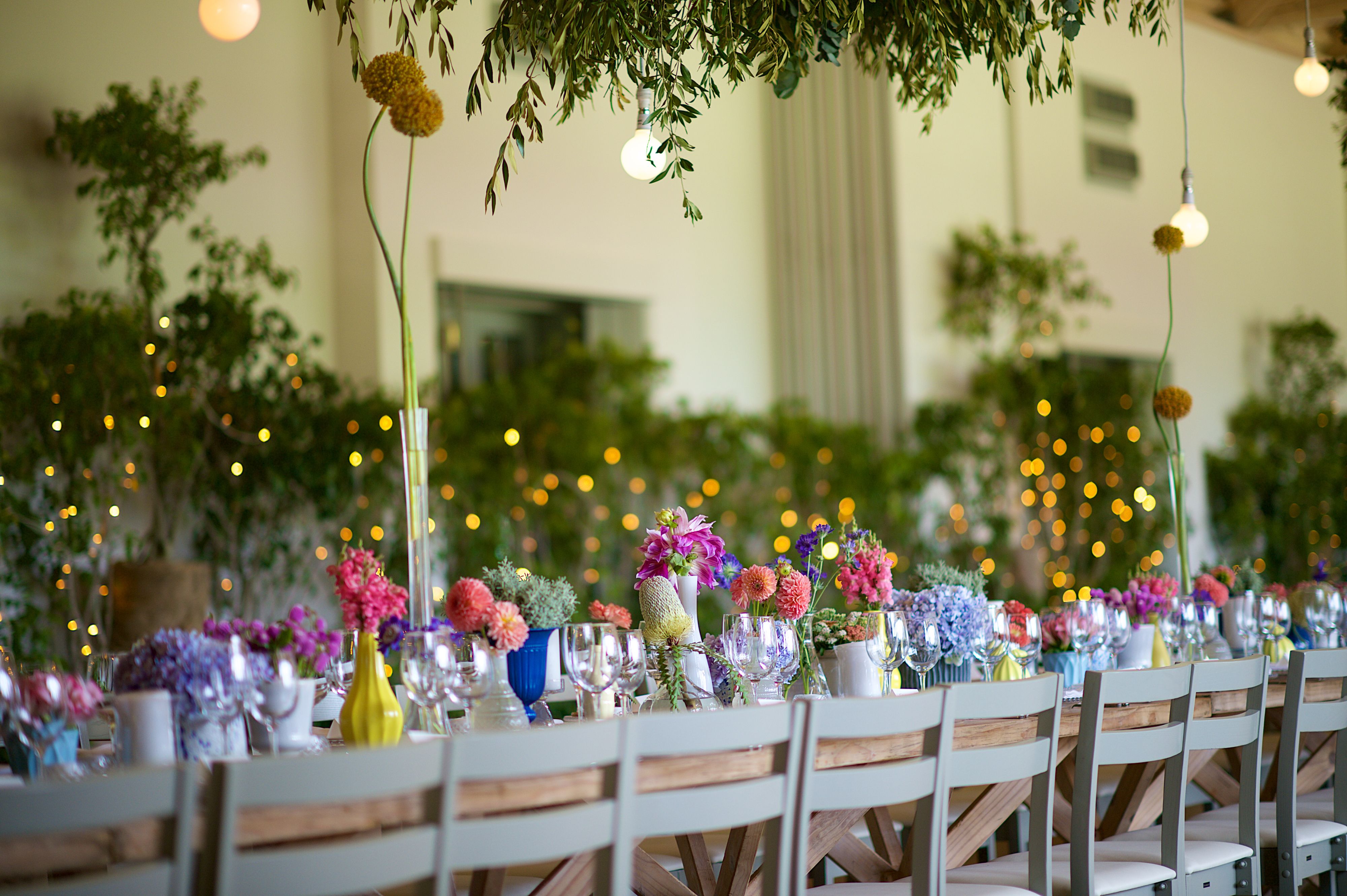 Colourful Wedding Summer Flower Arrangement Dinner Party with string lights Colourful Wedding Summer Flower Arrangement Dinner Party with string lights