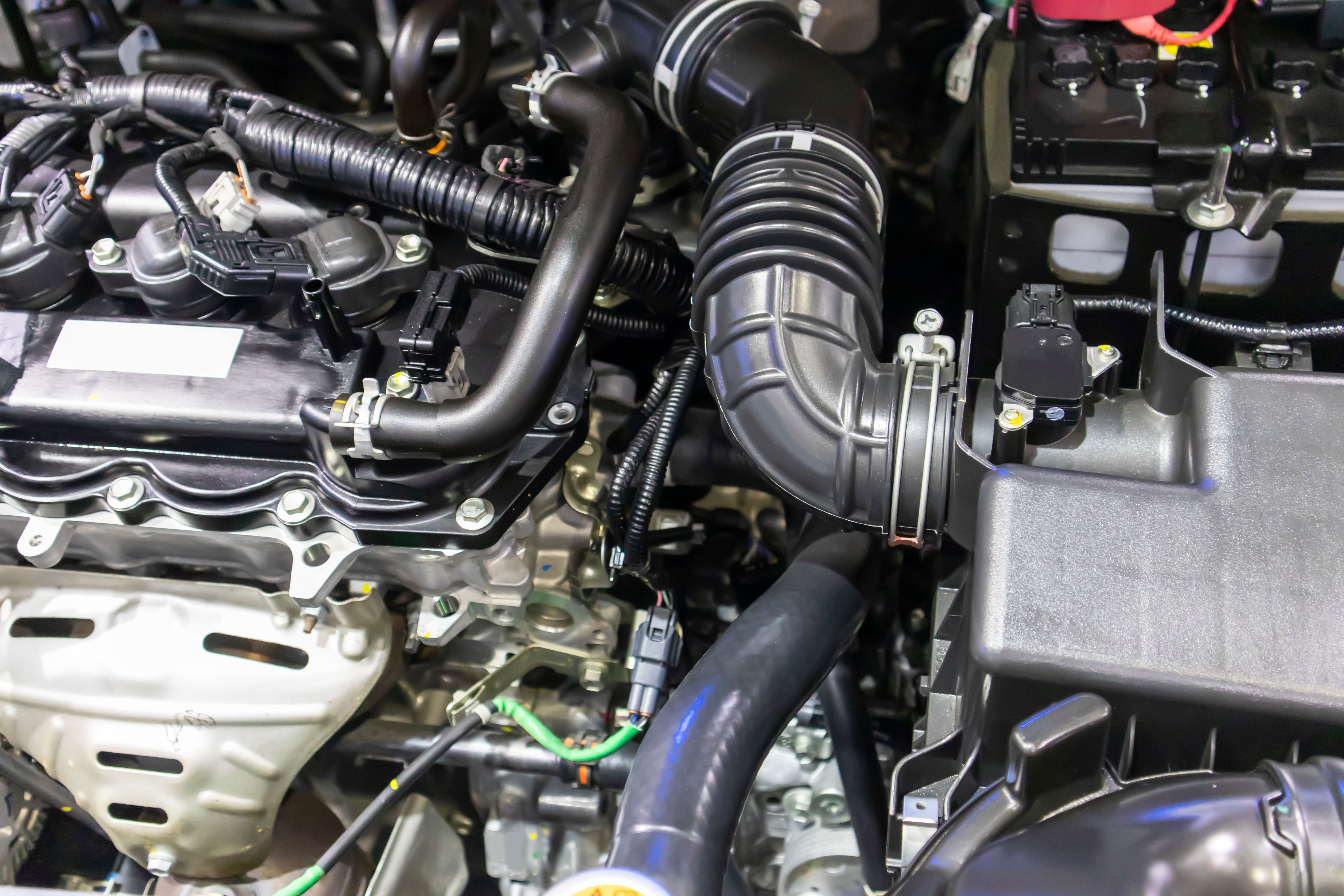 focused on the automotive industry within the contemporary new automobile engine room, machine displays all components and has an open hood. the new car's engine compartment.