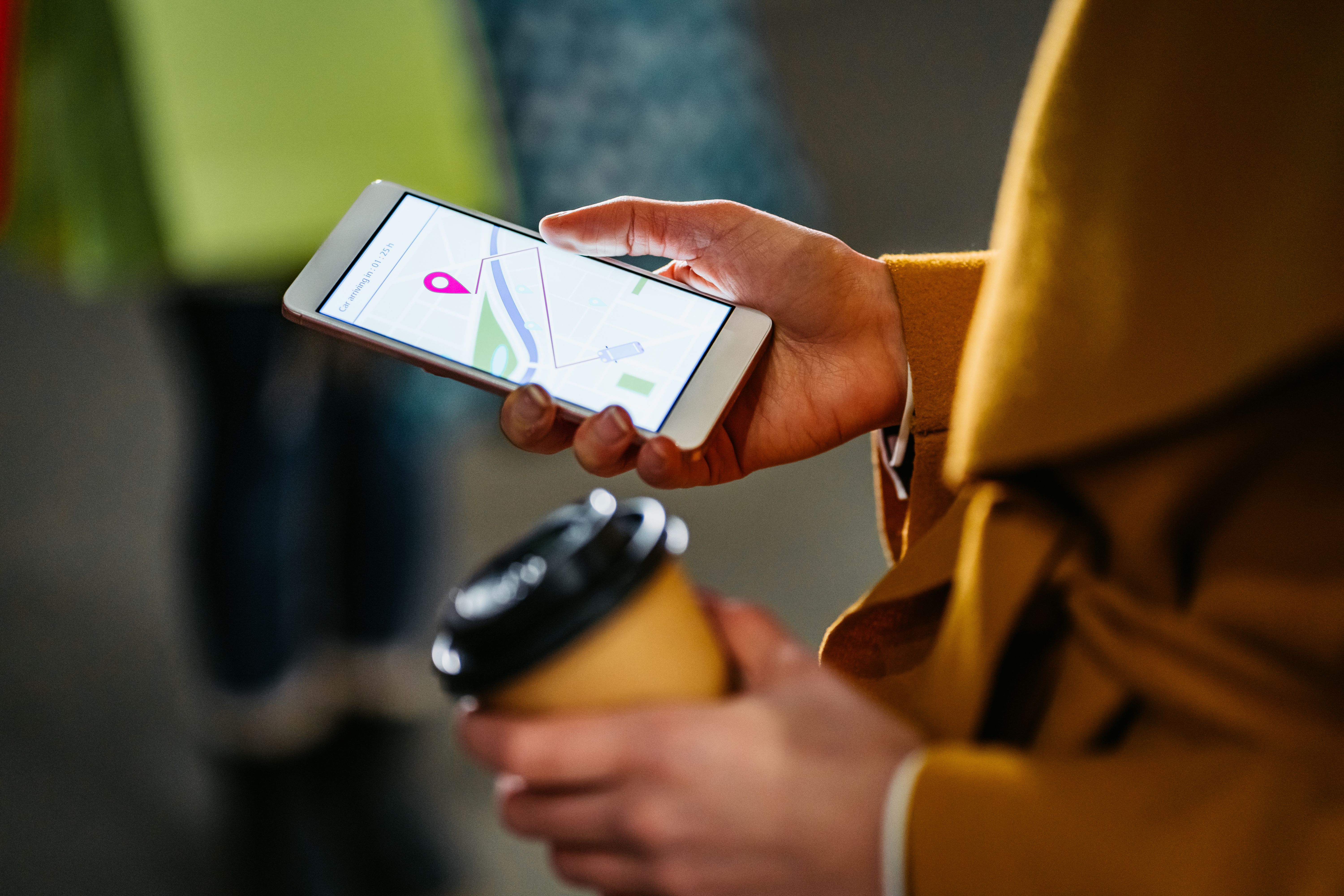 Young woman calling crowdsourced taxi