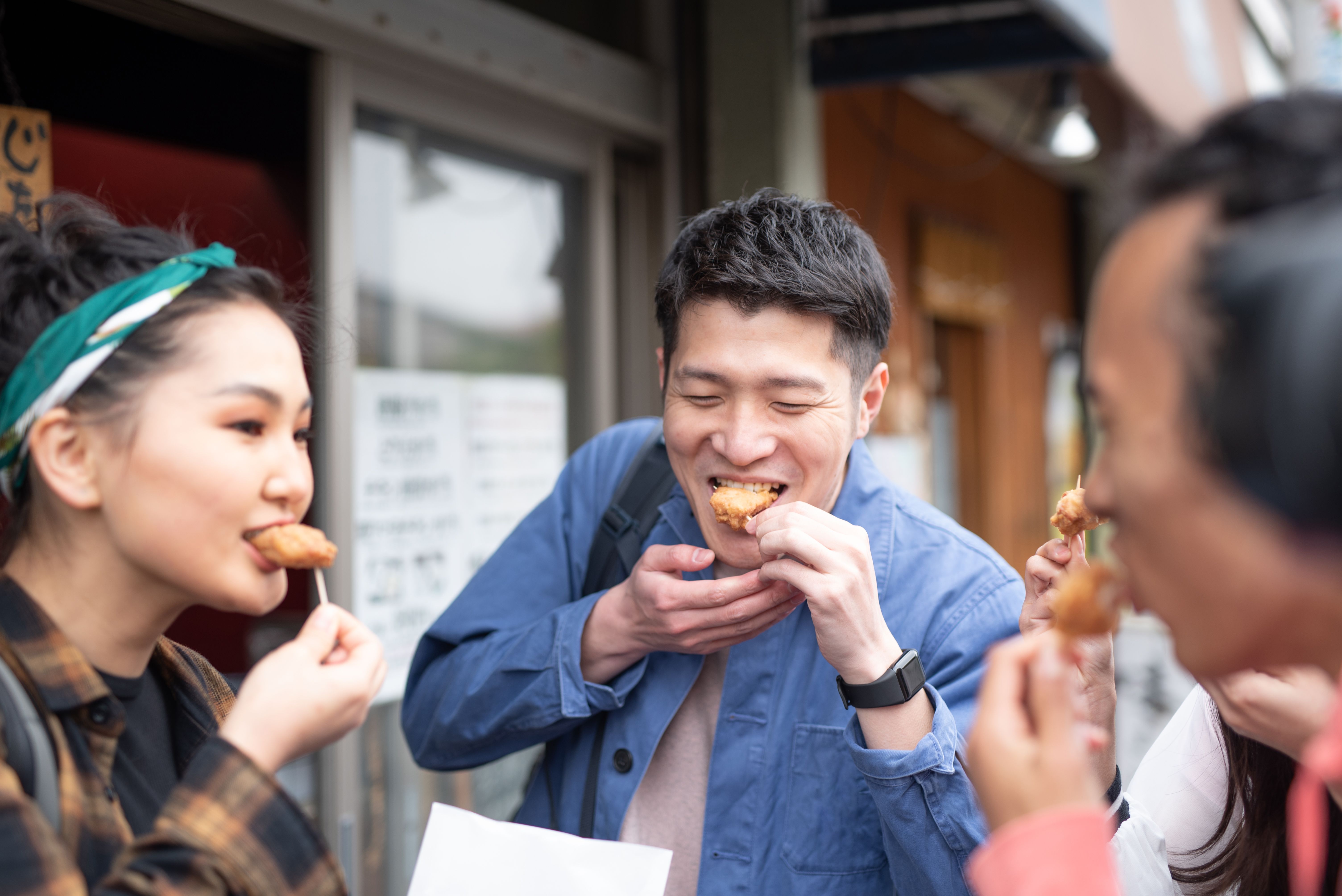 people eating yakitori