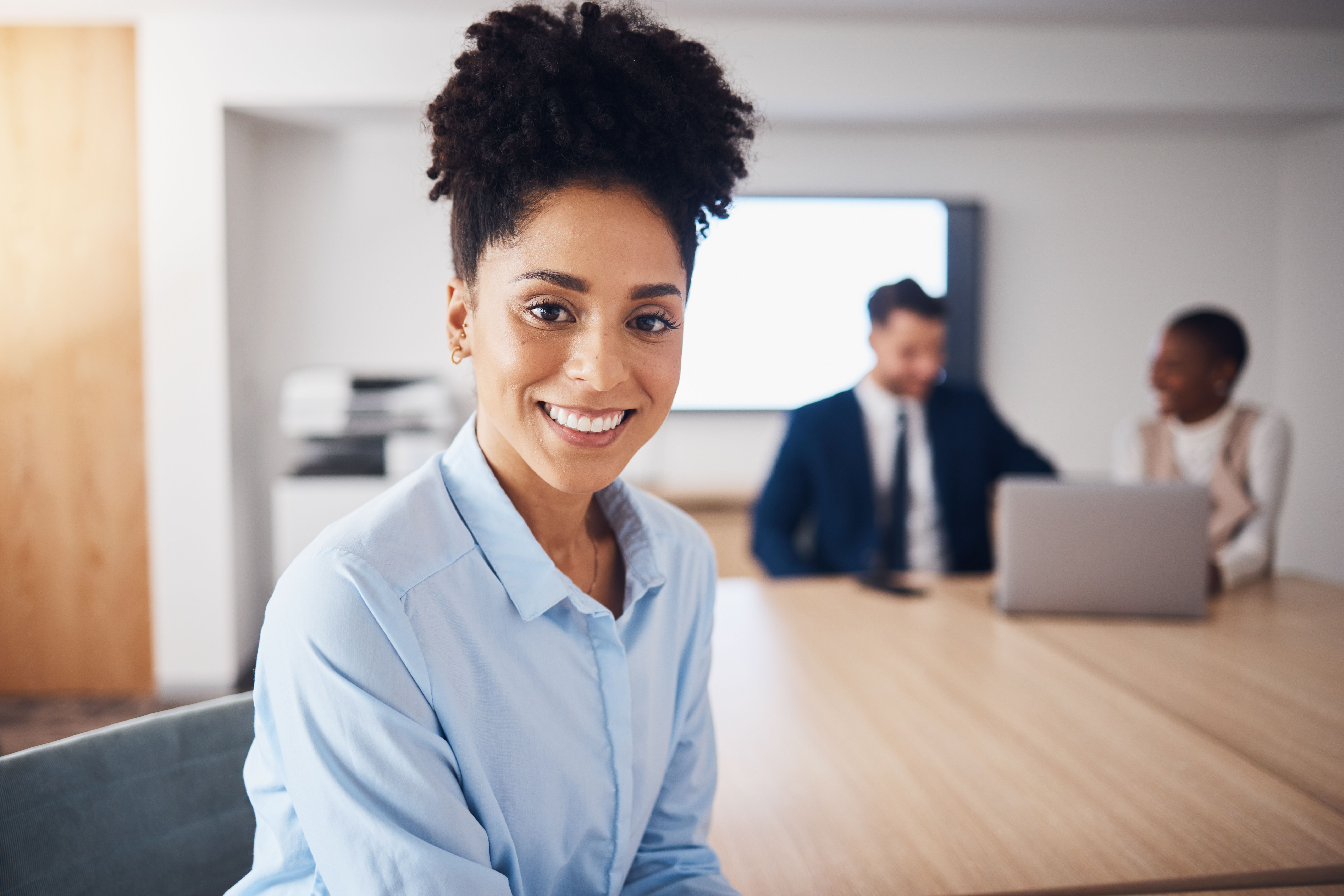 Portrait of happy black woman for professional leadership, mindset and planning in conference room. Young employee, worker or corporate person with employees management, workflow and career mindset