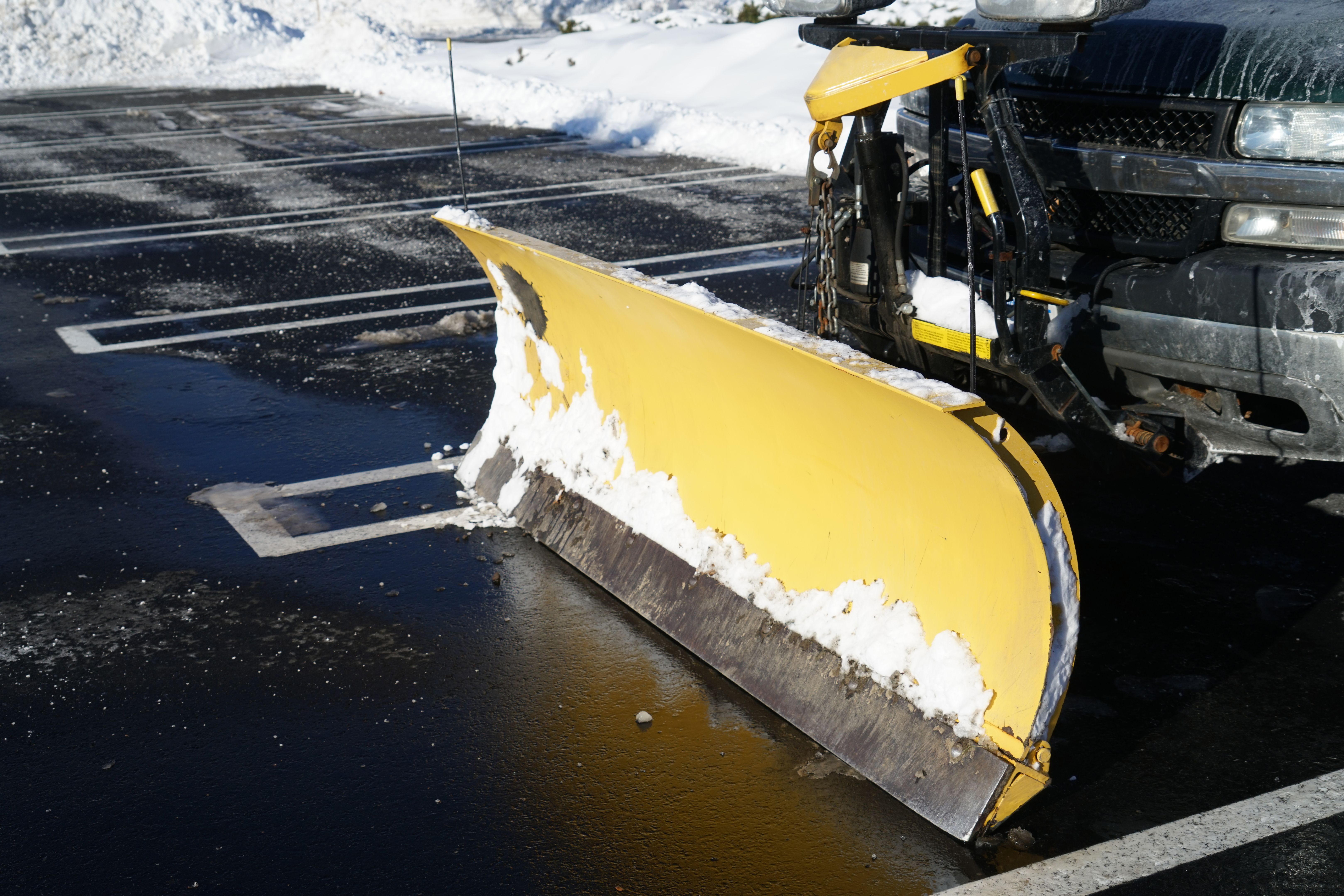 truck with snowplow installed in the parking lots truck with snowplow installed in the parking lots