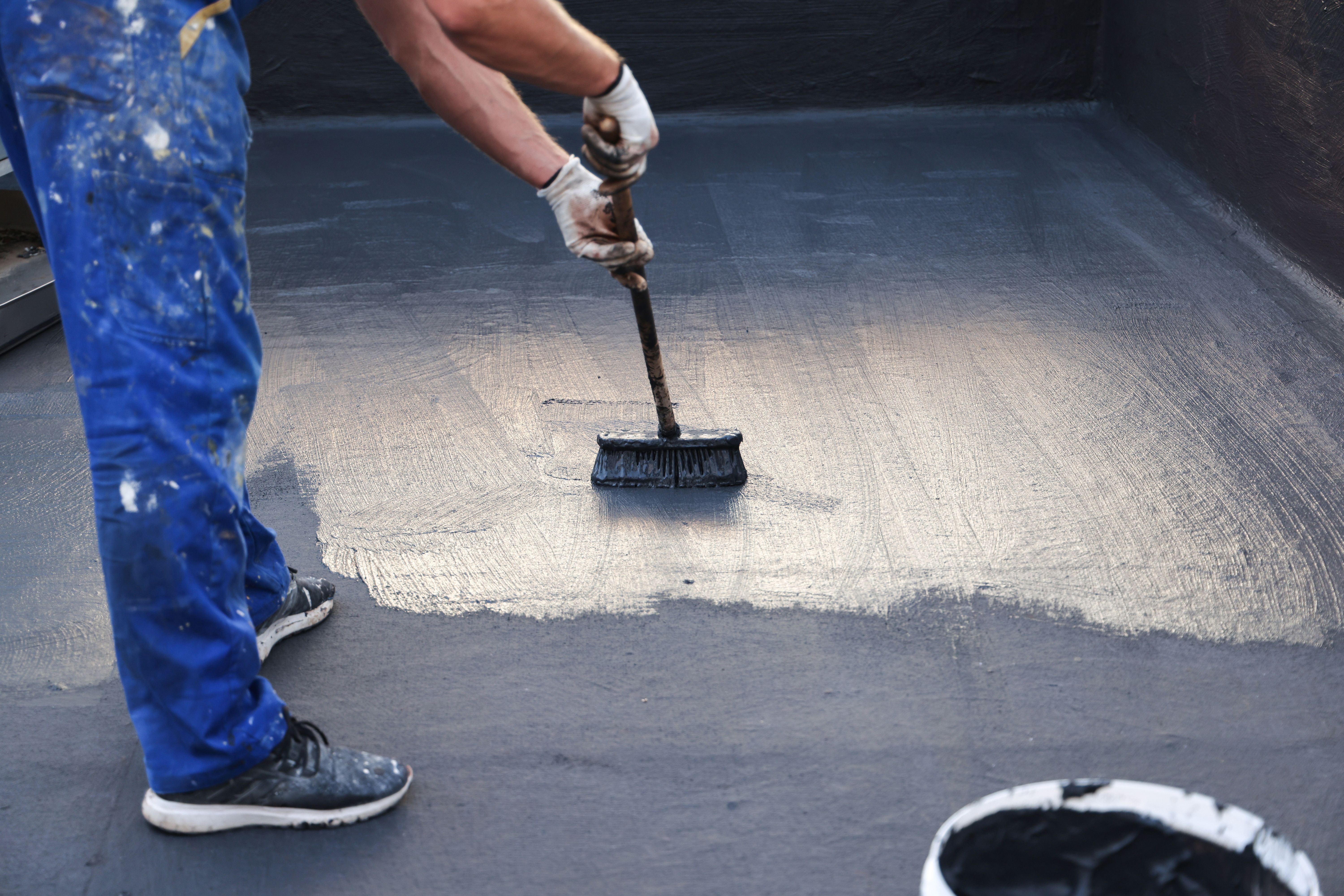 Worker Applying a Roof Waterproofing