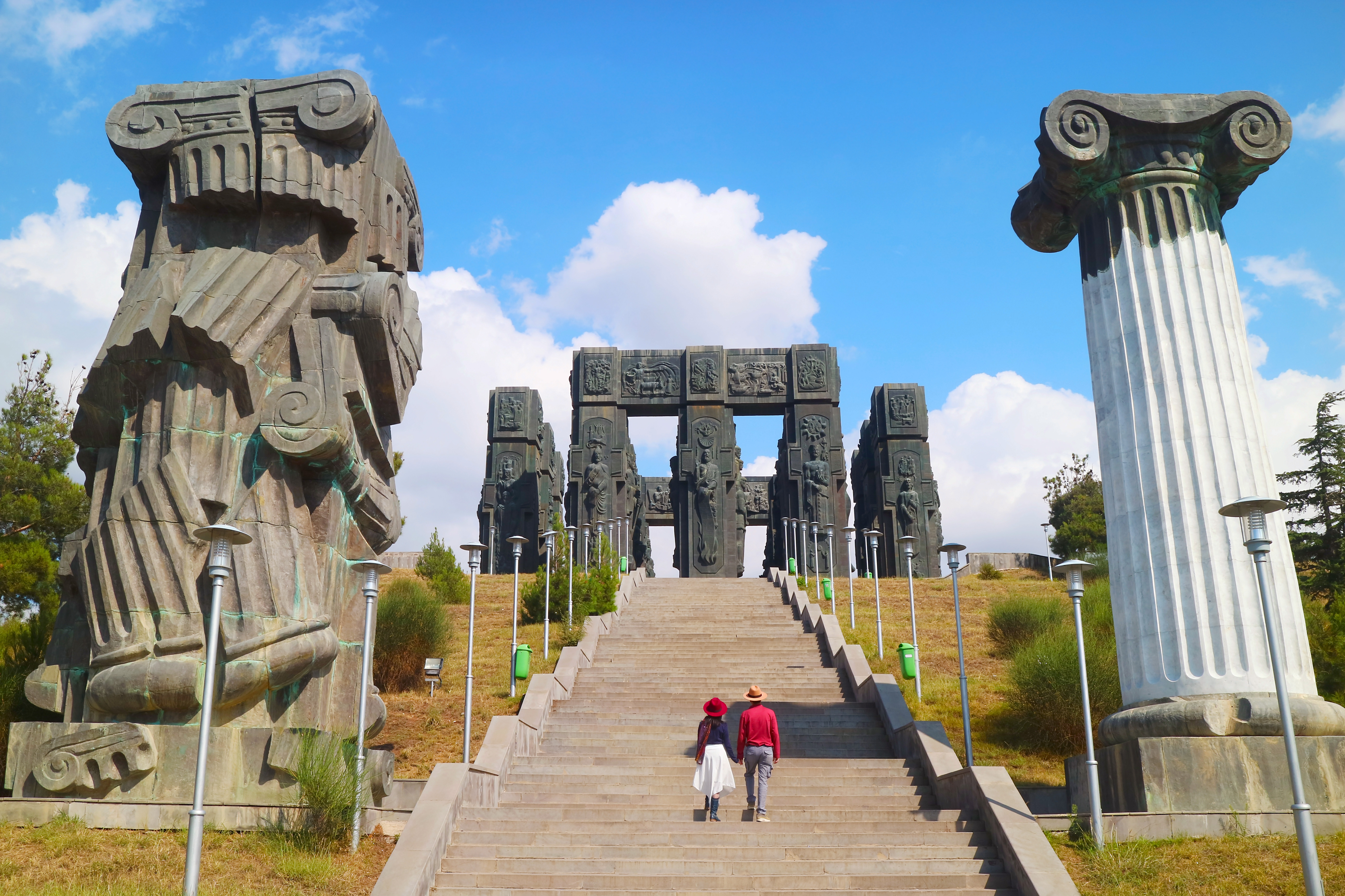 Couple on the Staircase of the Chronicle of Georgia, an Incredible Monument Located on the Hilltop near Tbilisi, Georgia, Created by Zurab Tsereteli in 1985 Couple on the Staircase of the Chronicle of Georgia, an Incredible Monument Located on the Hilltop near Tbilisi, Georgia, Created by Zurab Tsereteli in 1985