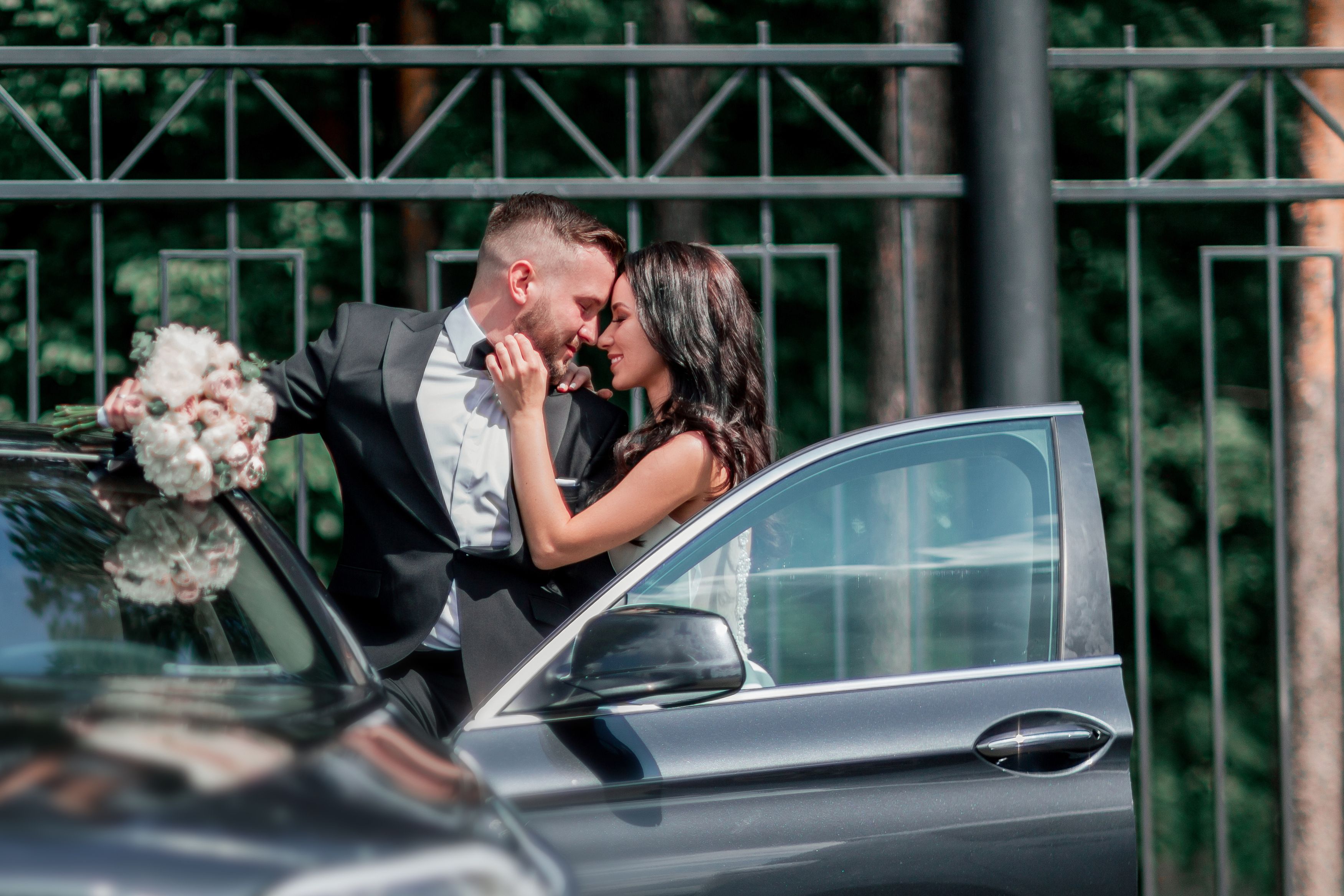 wedding couple with car