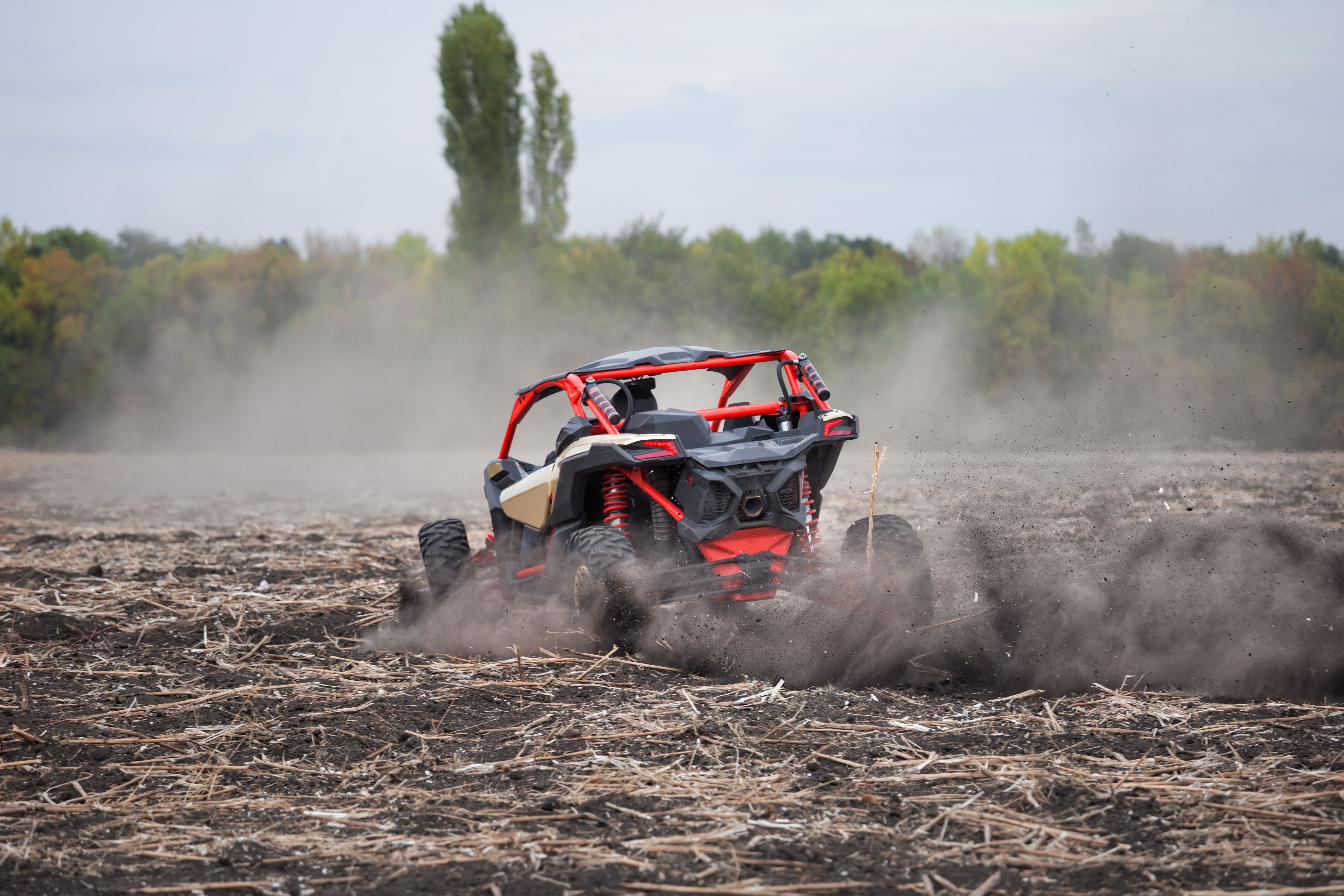 Leaving a quad bike with driver in plowed field