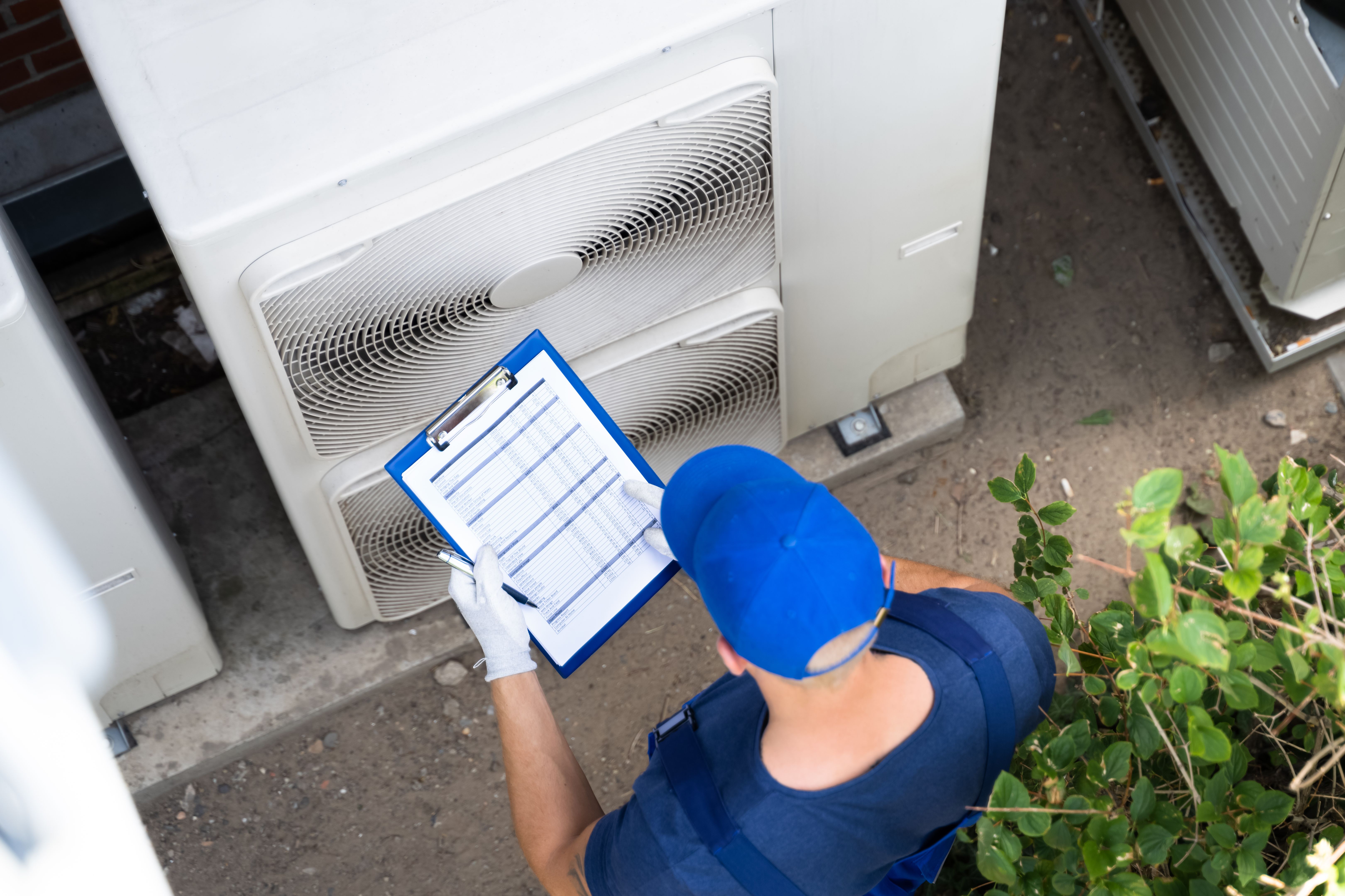 technician inspecting heating