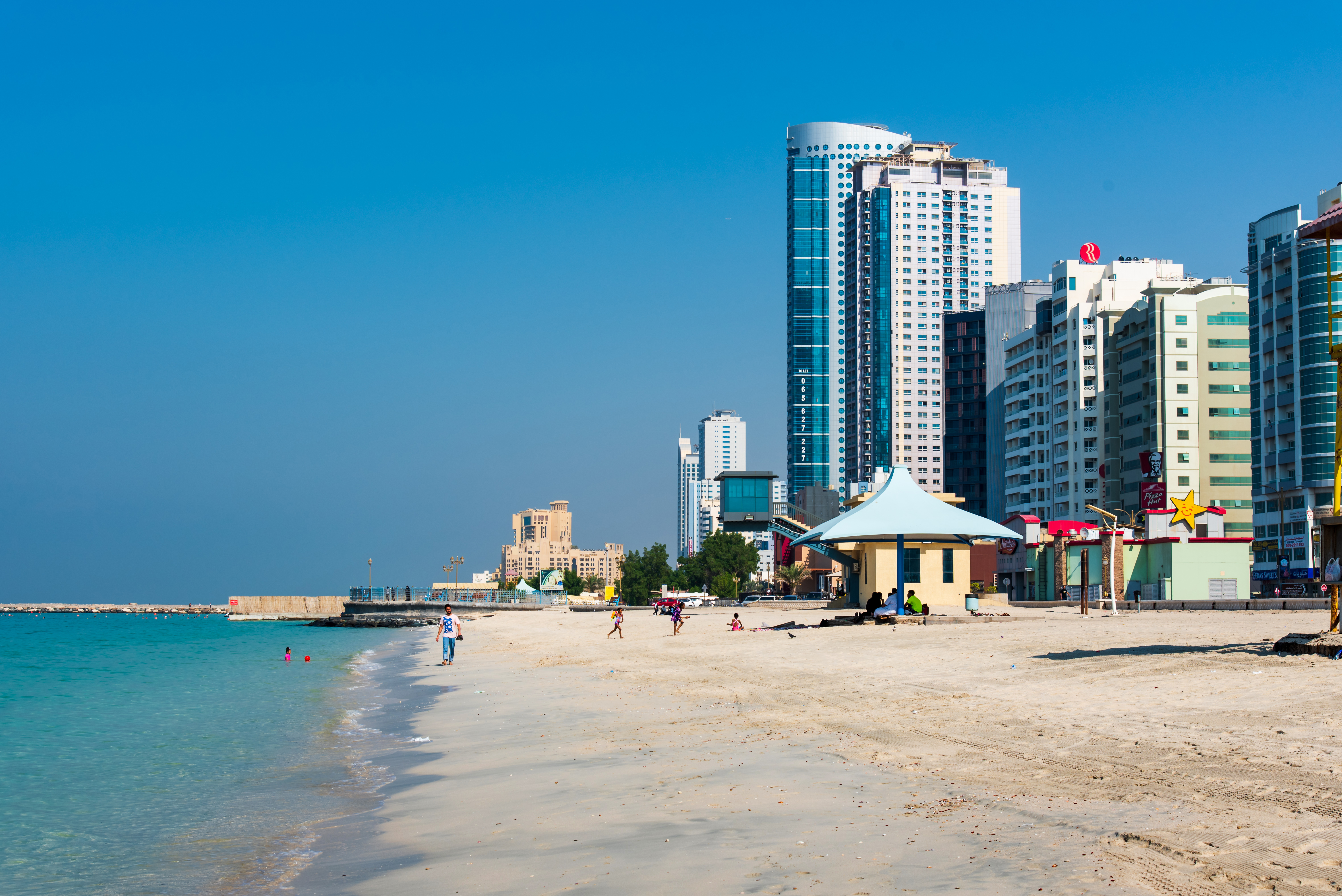Ajman Corniche Beach beautiful coast in the city downtown area surrounded by high residential buildings