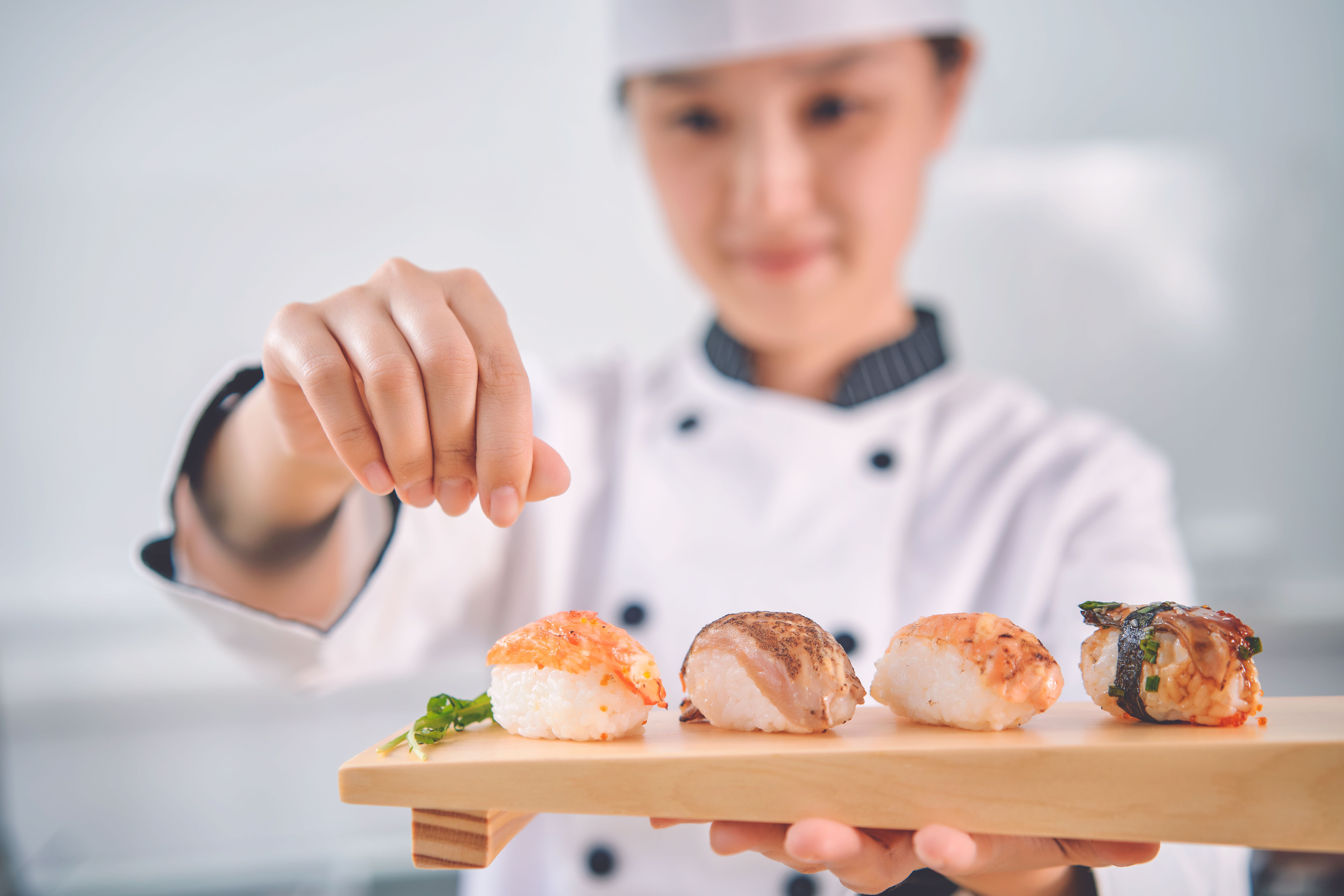 chef preparing sushi