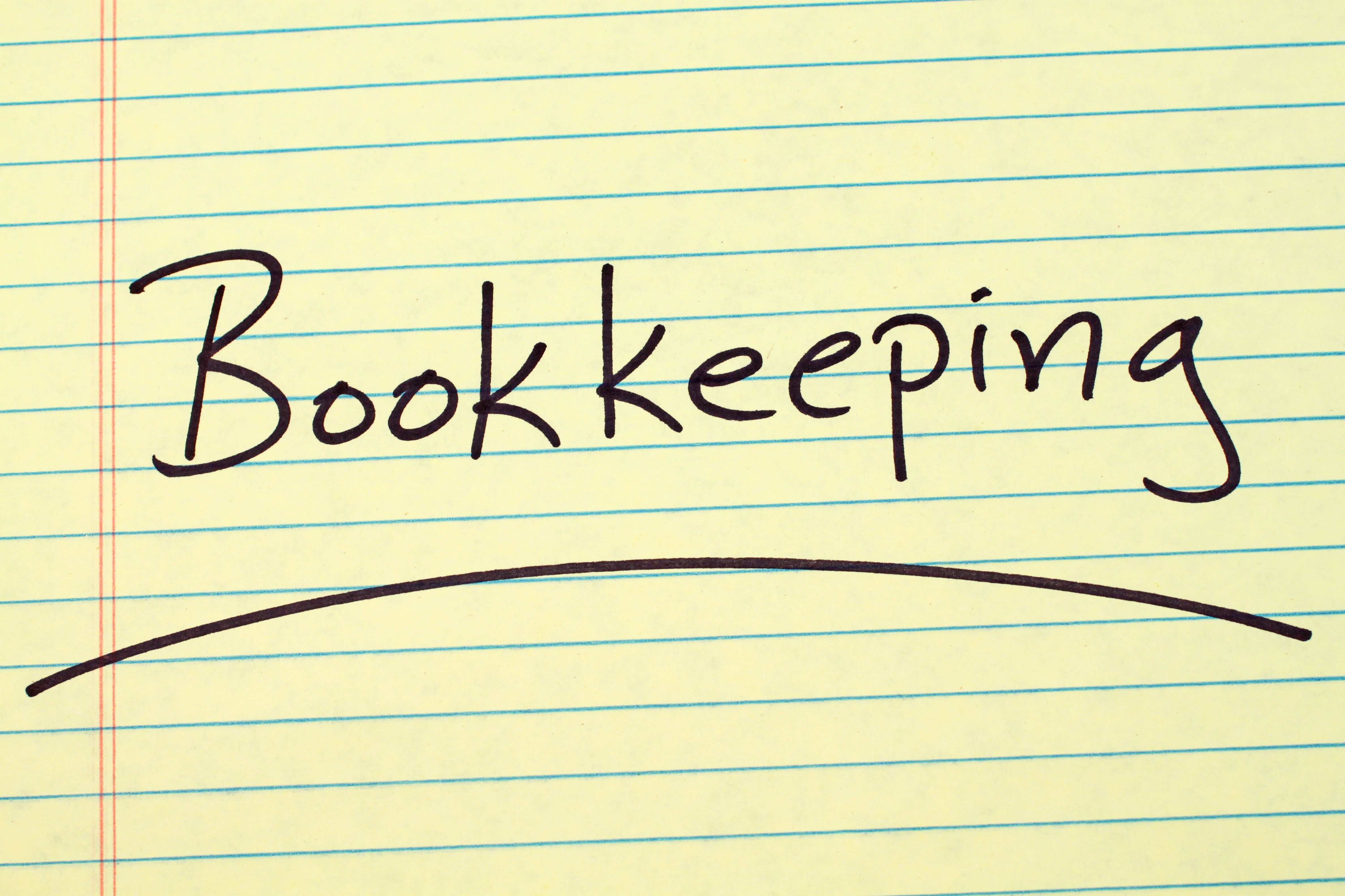 Bookkeeping On A Yellow Legal Pad