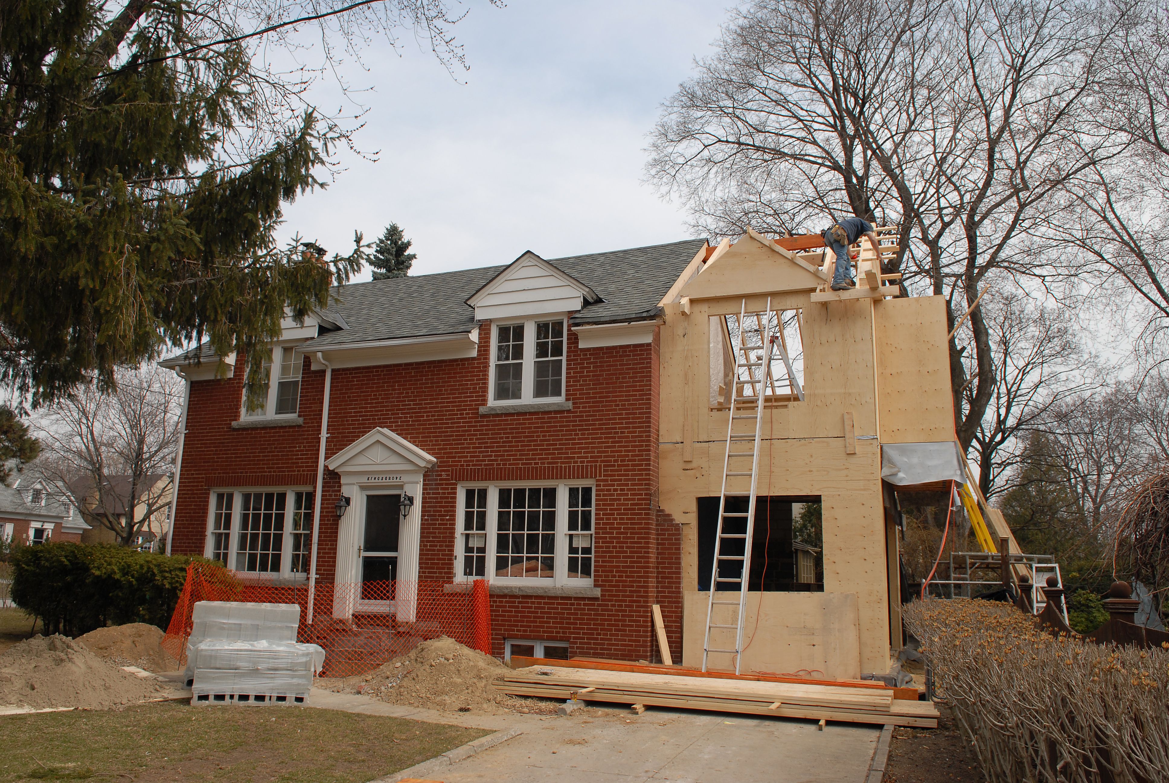 Quaint red Colonial house addition