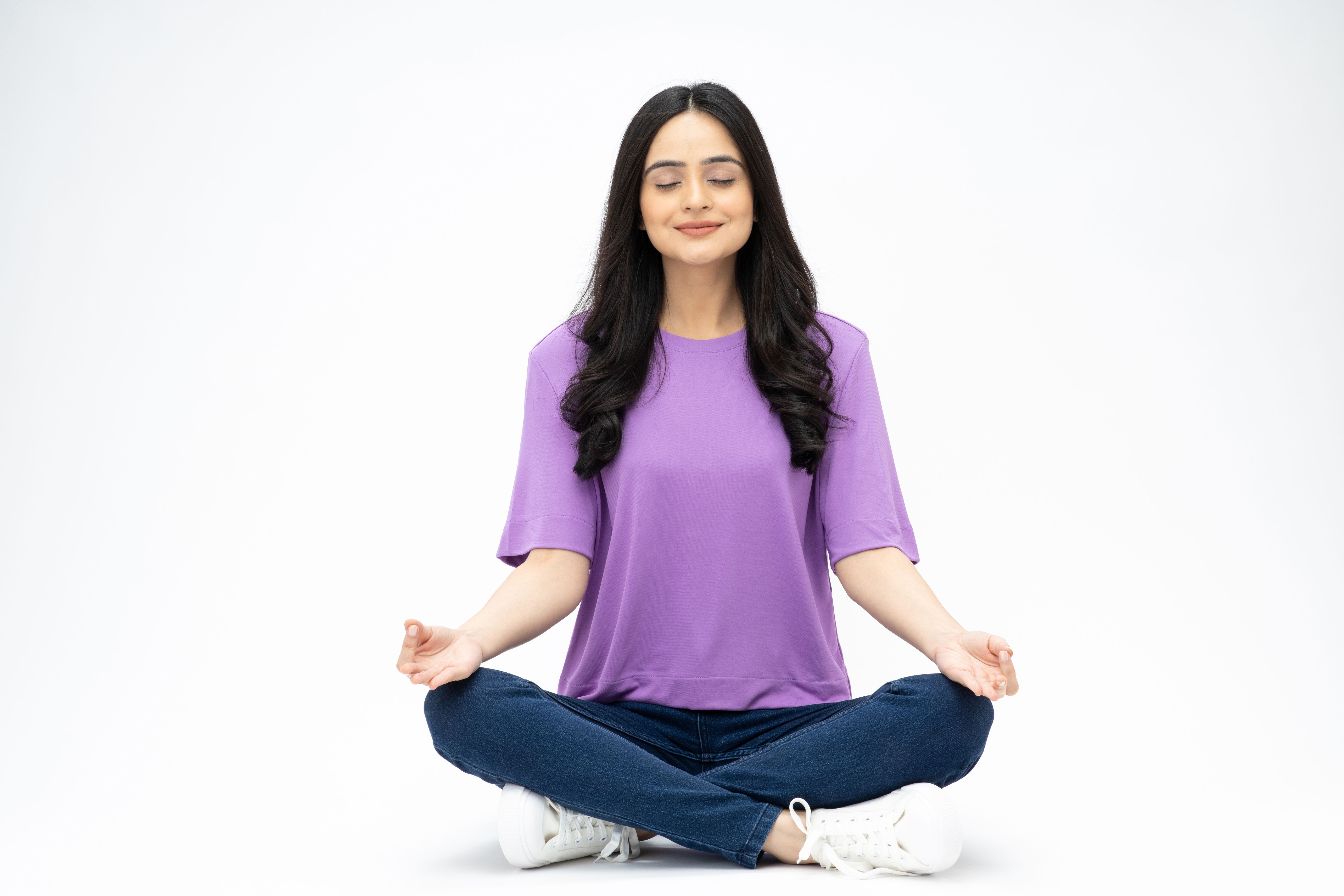 Photo of cheerful loverly woman wear trendy clothes sit floor empty space isolated on white background stock photo