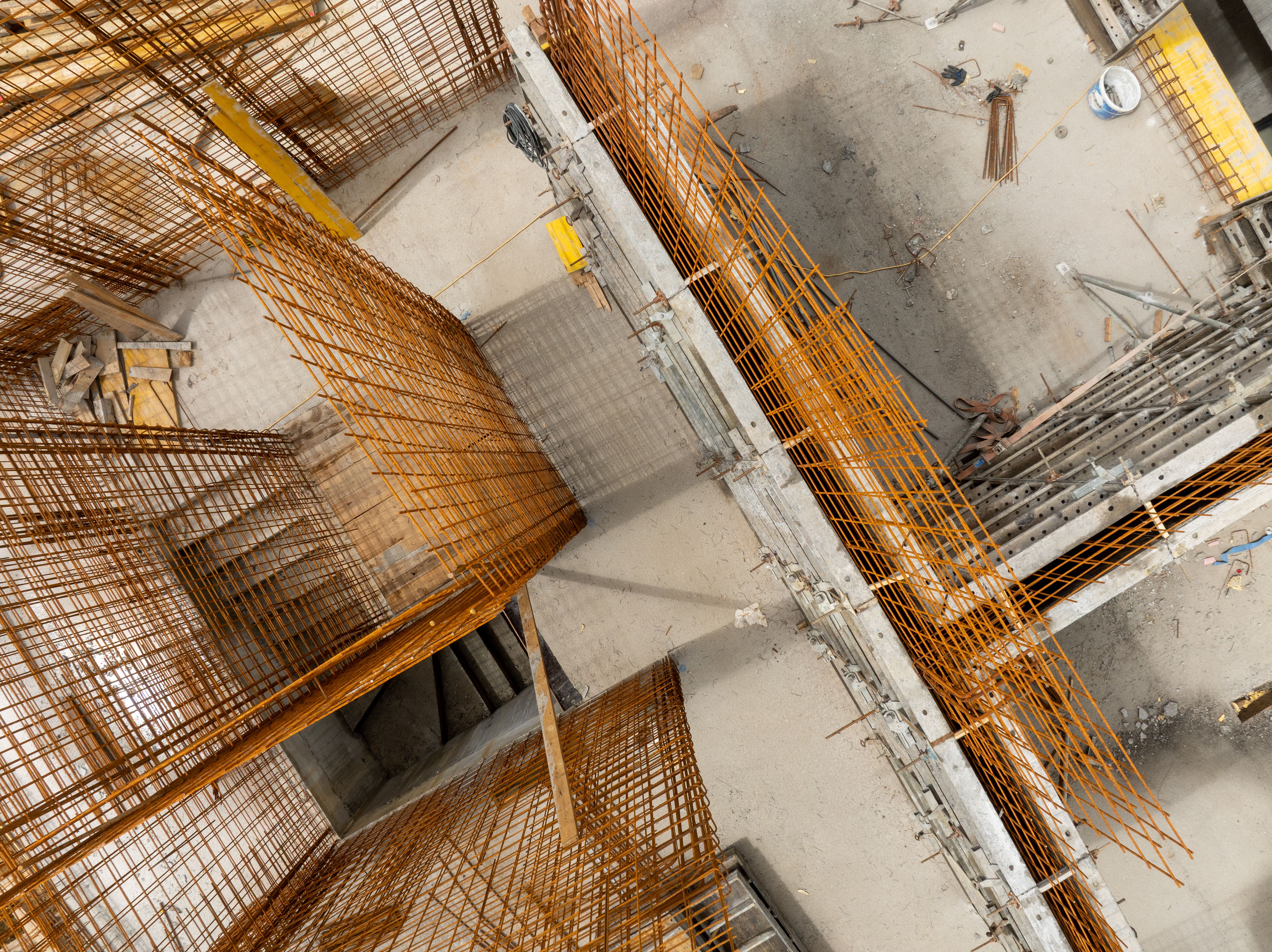 Construction site with reinforcement bar framework on concrete floor aerial view Preparation for concrete pouring