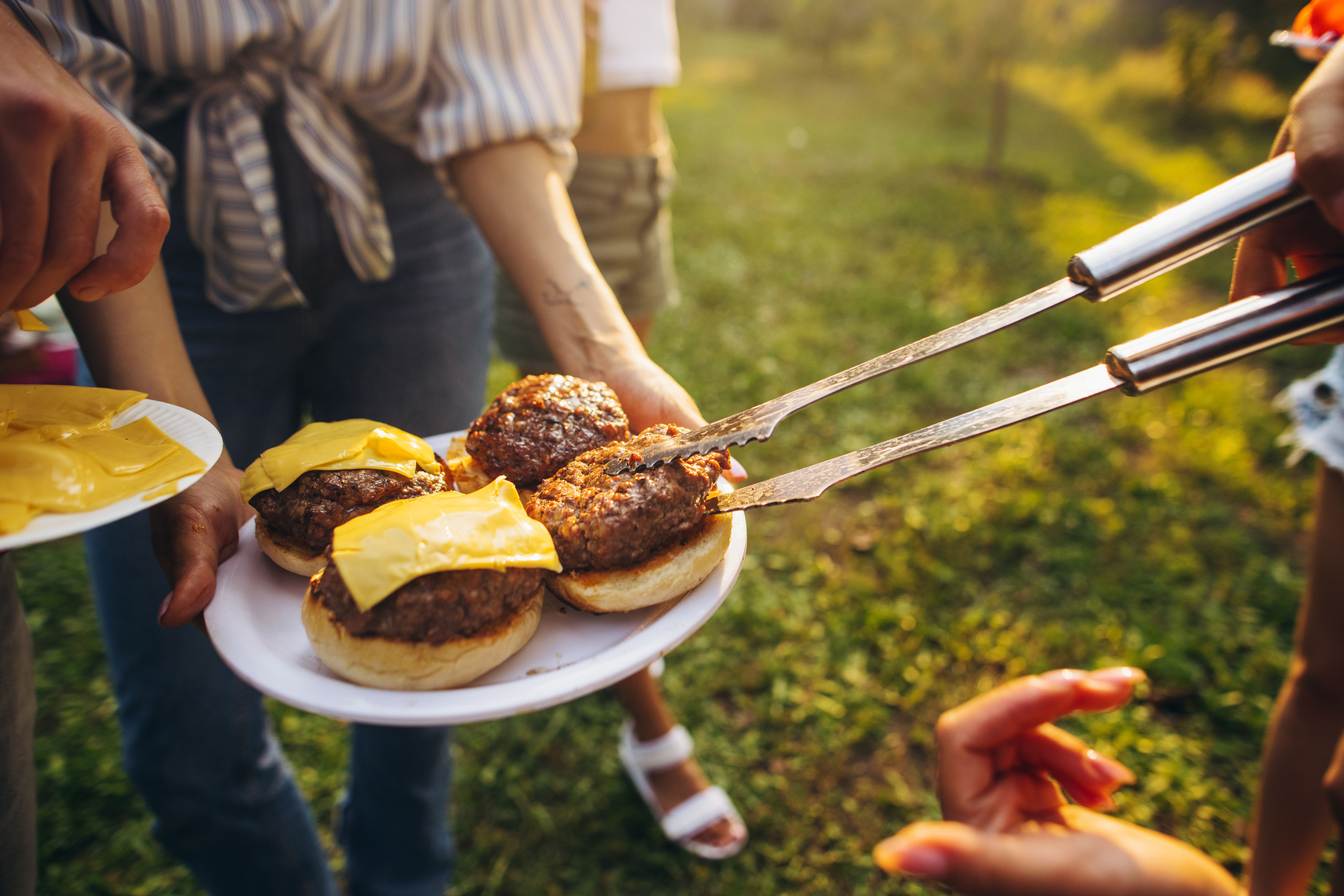 people enjoying burgers