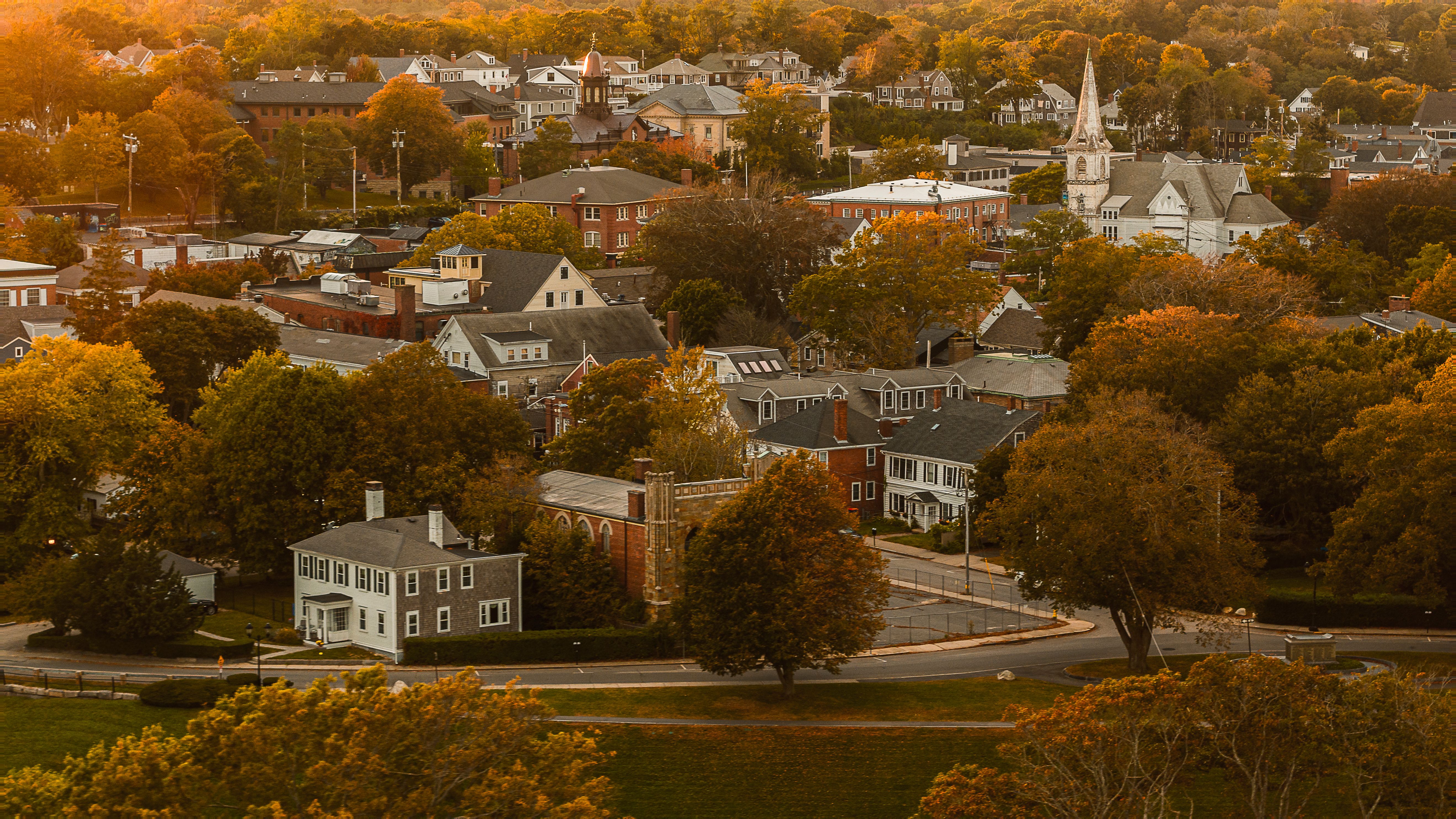 Distant view of the Plymouth town, Massachusetts, in the light of the setting sun. Distant view of the Plymouth town, Massachusetts, in the light of the setting sun.
