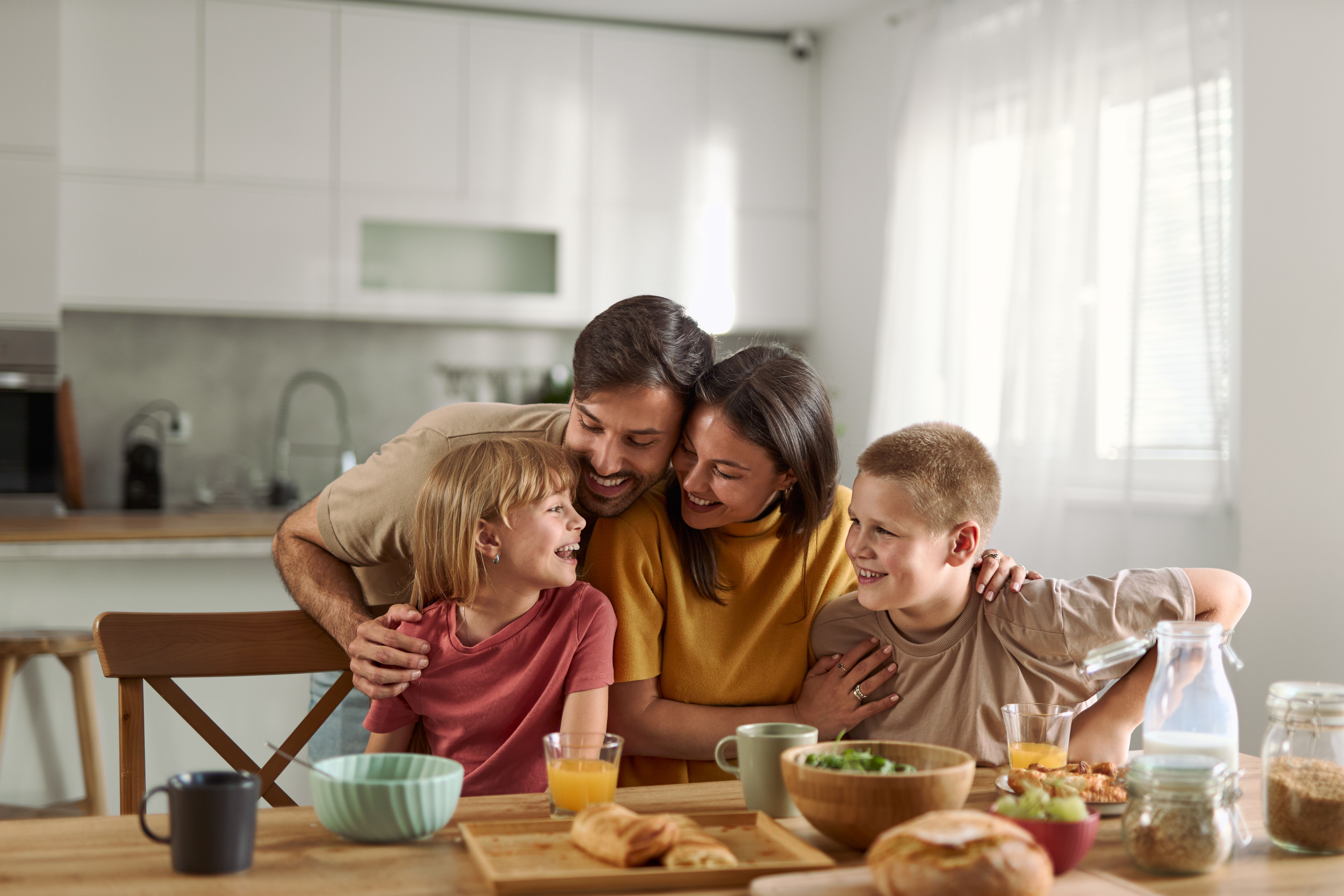 Young family having a meal together at home Young family having a meal together at home